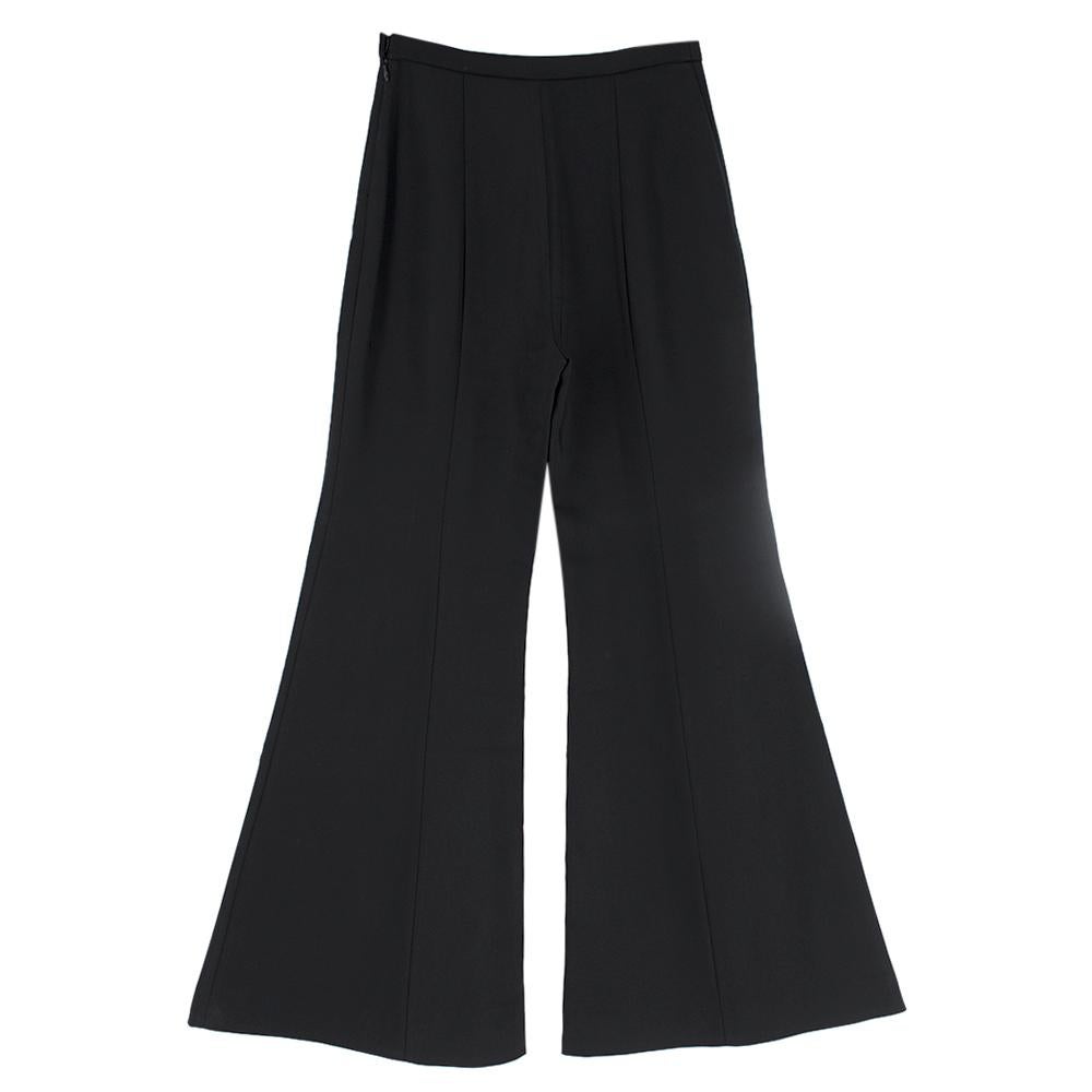 Rosetta Getty Black Jersey Pintuck Flared Trousers

Long, black flare trousers
Side zip fastening with metal hook and button closure
Pressed creases 
Mid-weight material

Please note, these items are pre-owned and may show some signs of storage,