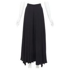 Rosetta Getty: pantalones harem negros de viscosa con pliegue invertido en la parte delantera y abertura lateral, talla US0 X