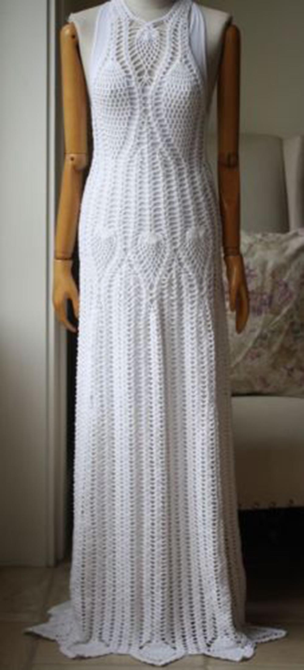 Inspired by a trip to Sayulita, Mexico, Rosetta Getty's ivory dress captures the spirit of youthfulness and travel. This floor-length style is hand-crocheted from glossy cotton-blend and includes a slip for coverage. Ivory crocheted cotton-blend.