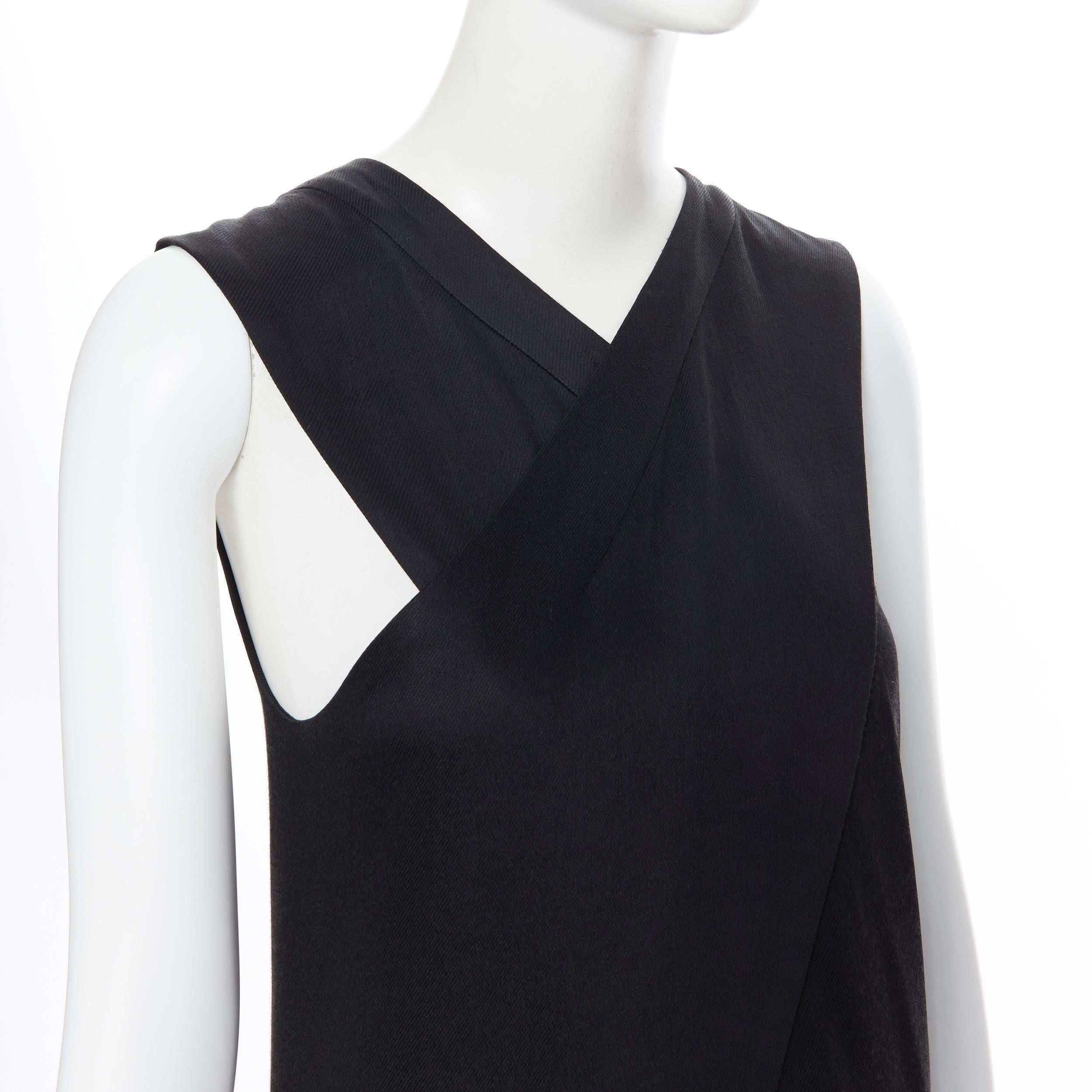 ROSETTA GETTY crossover front tail slit back sleeveless tunic top US2 XS
Brand: Rosetta Getty
Designer: Rosetta Getty
Model Name / Style: Crossover long top
Material: Viscose blend
Color: Black
Pattern: Solid
Extra Detail: Crossover front. Slit tail