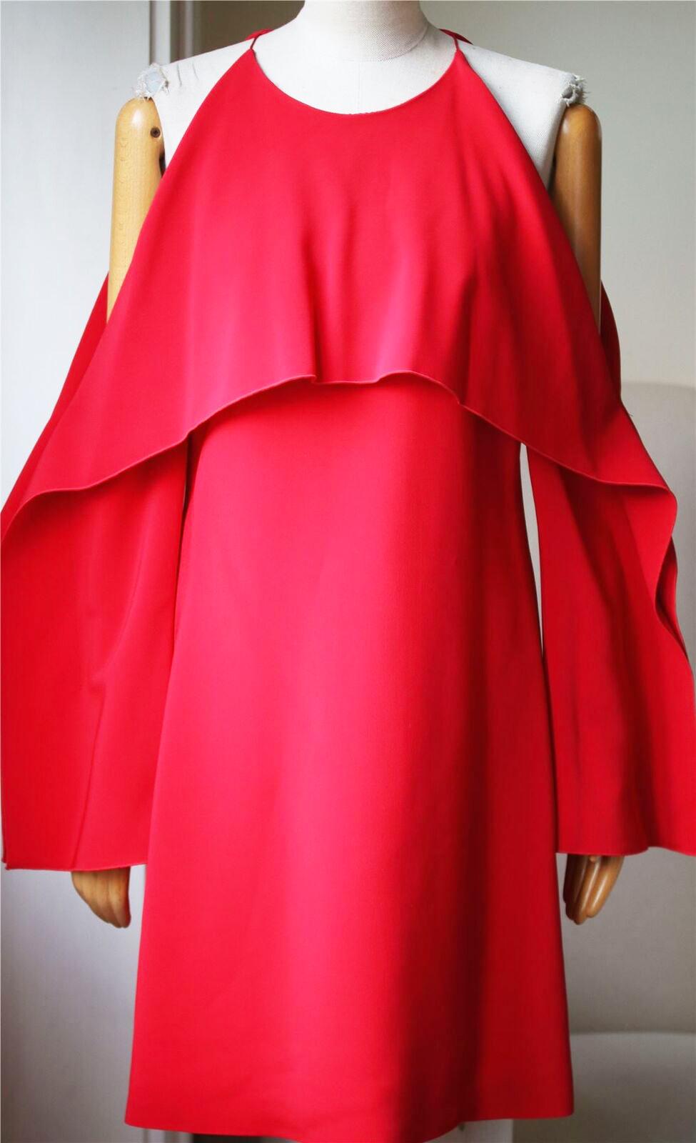 Made from stretch-cady, this dress has a draped overlay that folds over the bodice, cutout shoulders and wide, geometric sleeves. Red stretch-cady. Concealed zip fastening along back. 96% viscose, 4% elastane; lining: 93% silk, 7% spandex. Designer
