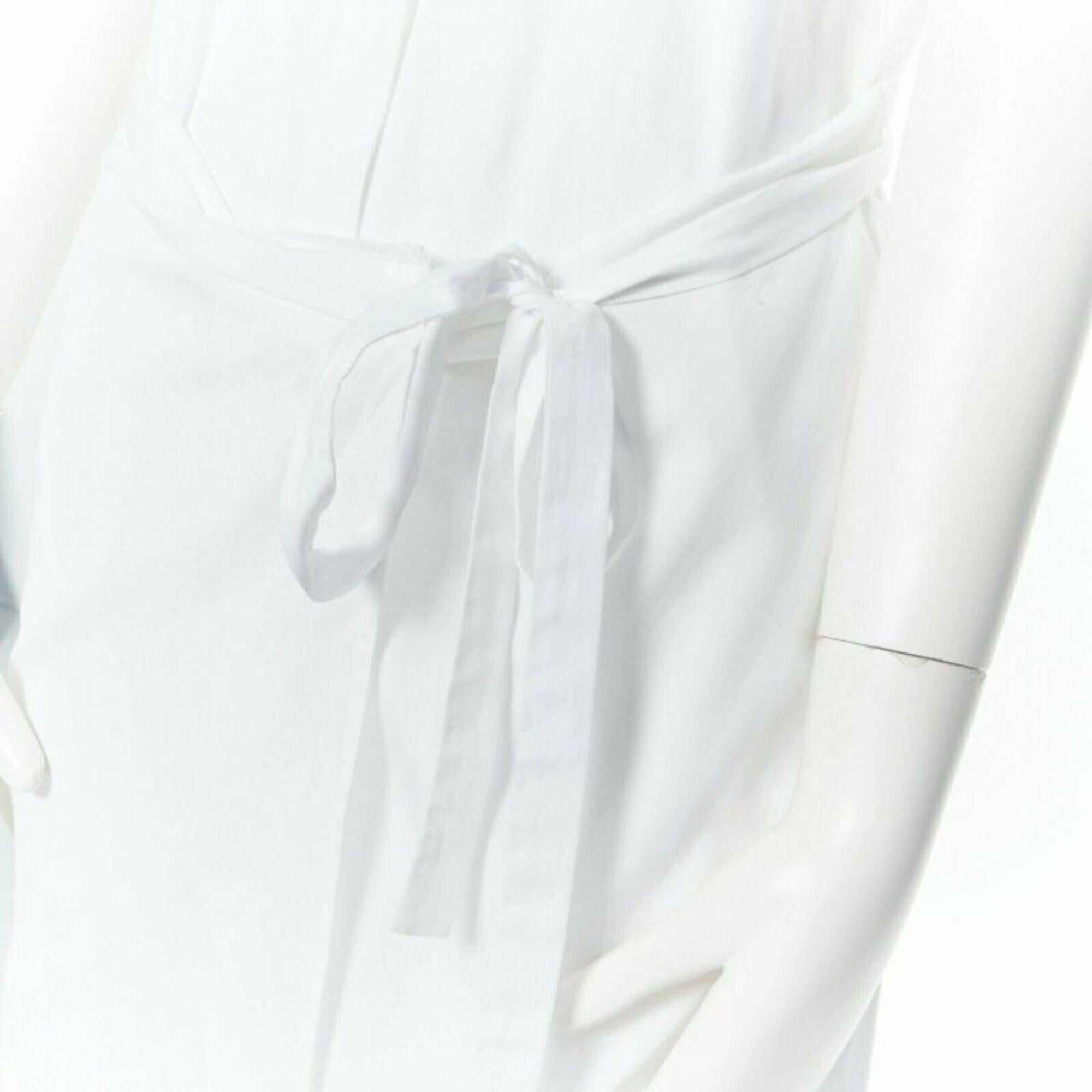 ROSETTA GETTY white cotton maxi long shirt dress apron fold minimal tie US0 XS
Reference: LNKO/A01105
Brand: Tibi
Material: Cotton
Color: White
Pattern: Solid
Closure: Button
Extra Details: Shirt dress. Maxi length. Folded cap sleeves. Spread