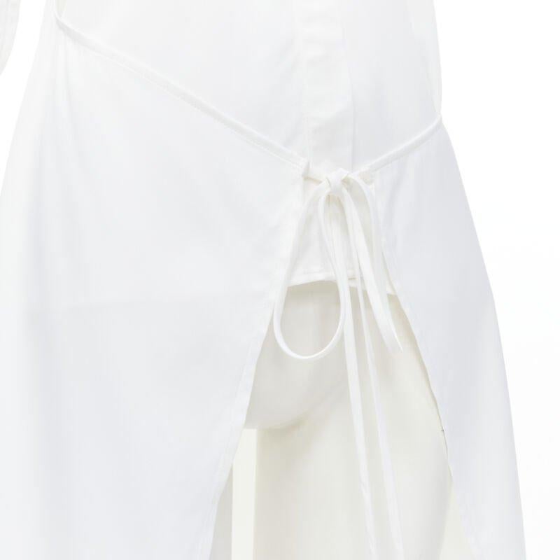 ROSETTA GETTY white viscose  long sleeve high low train hem shirt top US2 XS
Reference: LNKO/A01856
Brand: Rosetta Getty
Material: Viscose
Color: White
Pattern: Solid
Closure: Button
Made in: United States

CONDITION:
Condition: Very good, this item