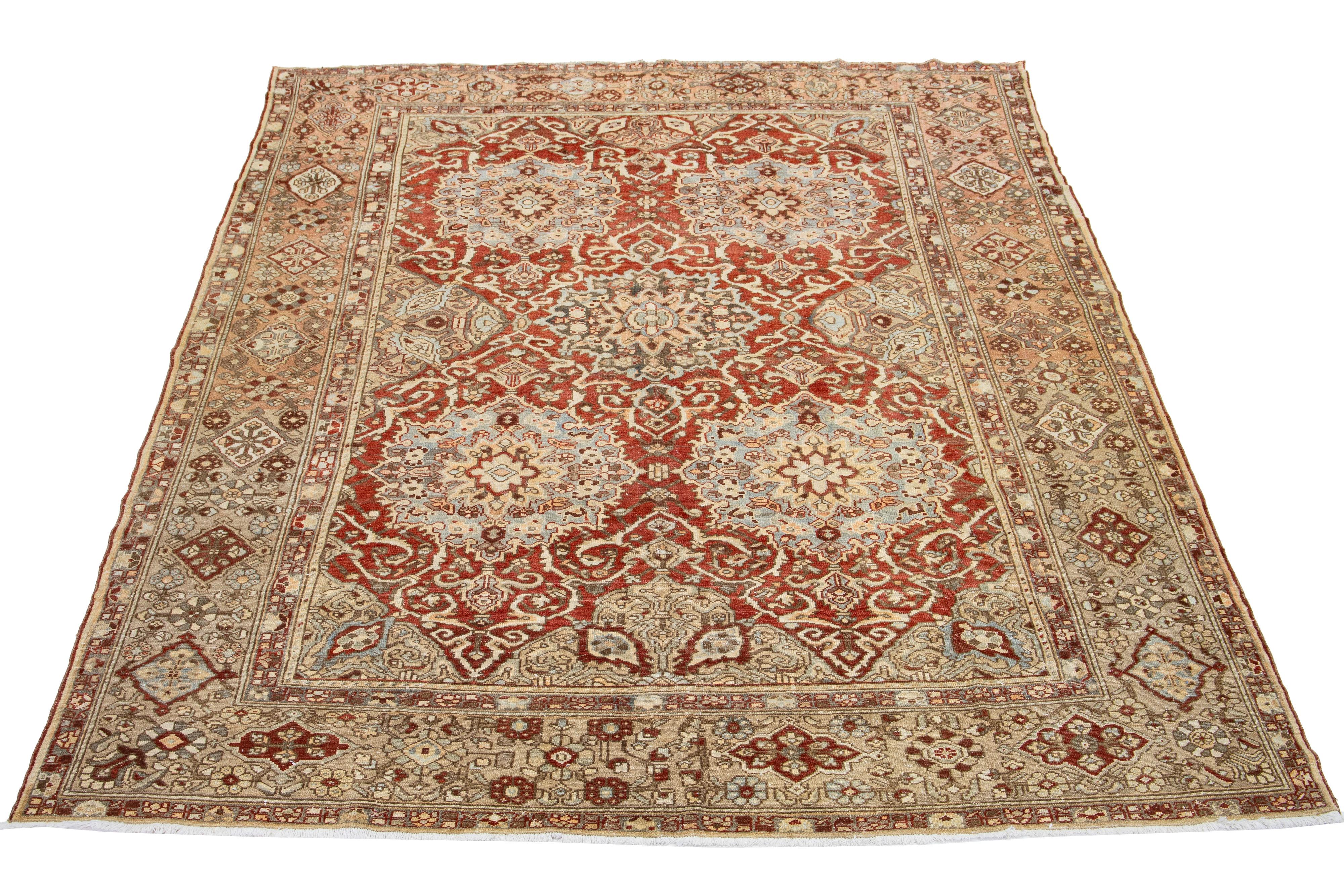Beautiful Antique Bakhtiari hand-knotted wool rug with a red-rust color field. This Persian piece has blue, beige, and peach hues on a classic rosette design.

This rug measures 9'7