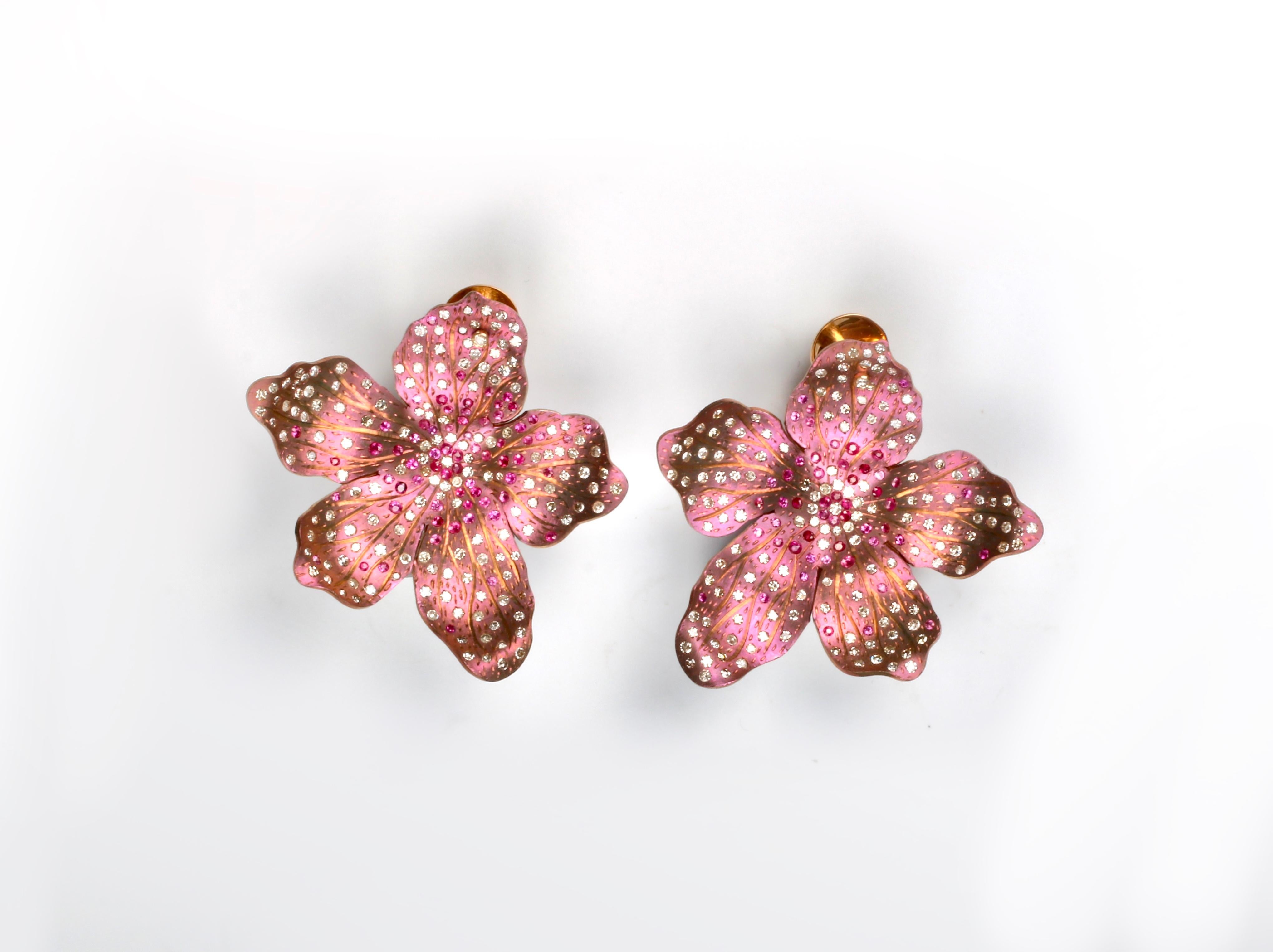 Roseus Periwinkle Titanium Flower Earrings with Rubies and Diamonds

3 carats of diamonds and 1.20 carats of Rubies. 18kt Gold backs.