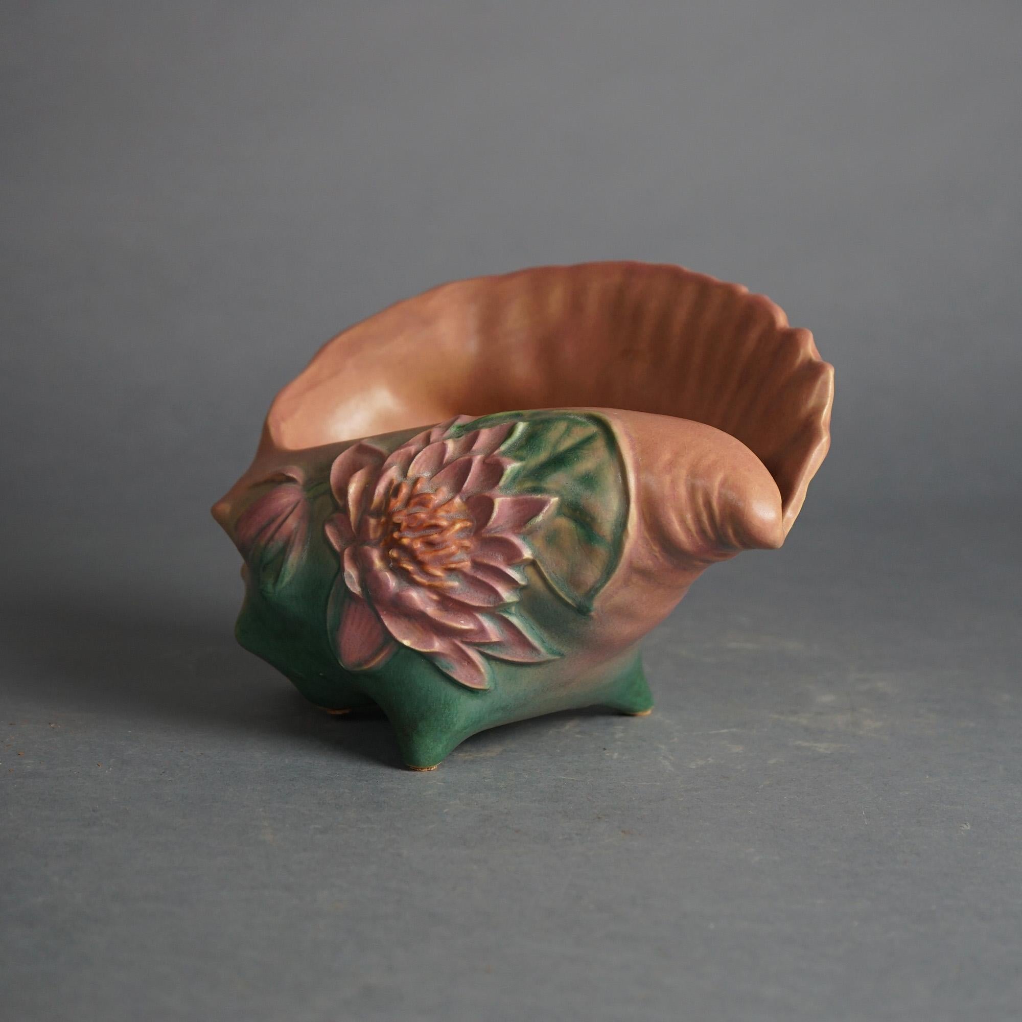Roseville Art Pottery Conch Shell, Water Lily in Pink, Signed, C1943

Measures- 6.5''H x 9''W x 5.25''D
