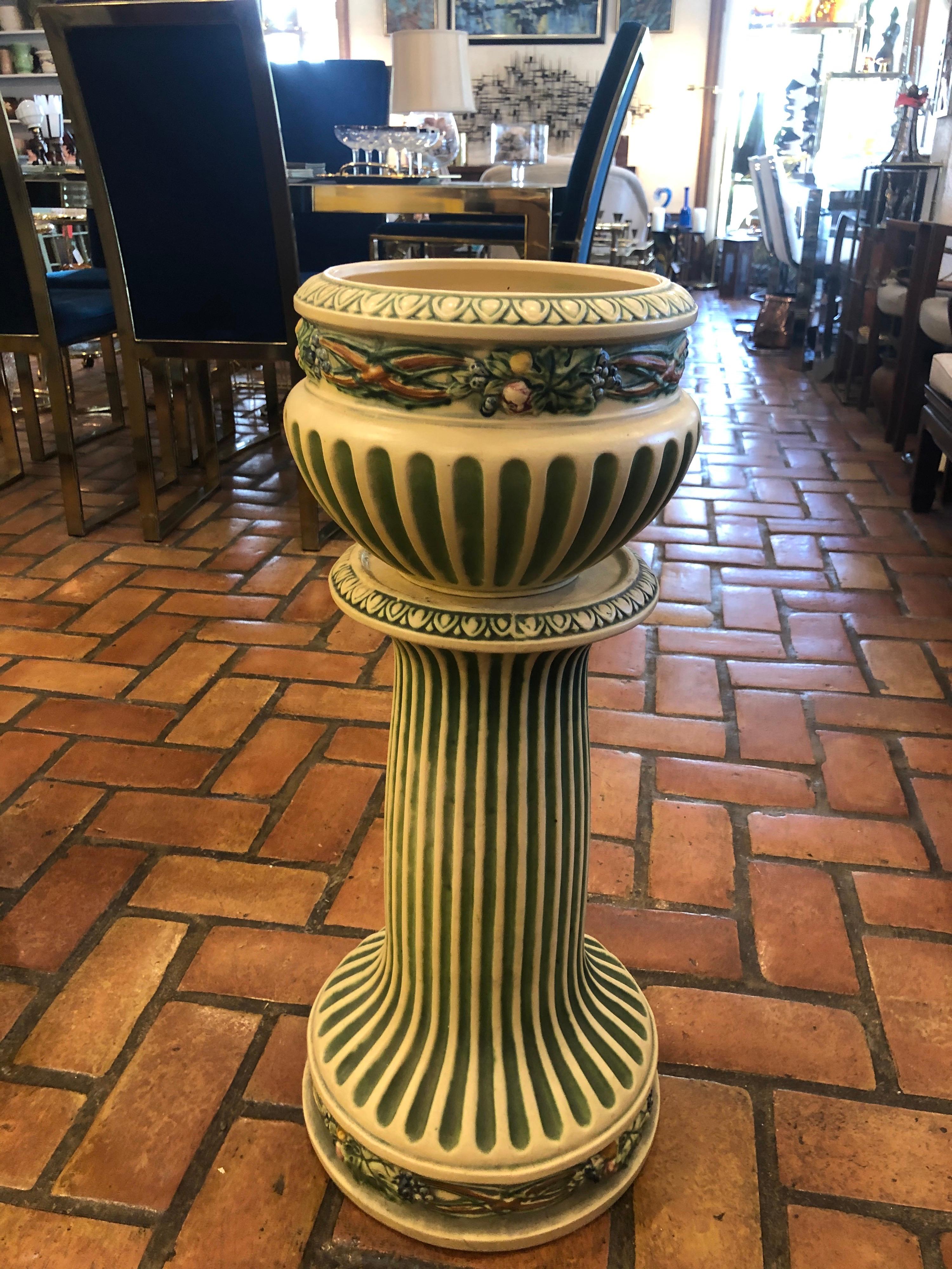 Roseville Corinthian pattern jardinière and matching pedestal. Rare set, perfect for any collector. In very good condition over all . No crazing , repairs or major damage . Small chip on underside of jardiniere base only. See last two photos. Double