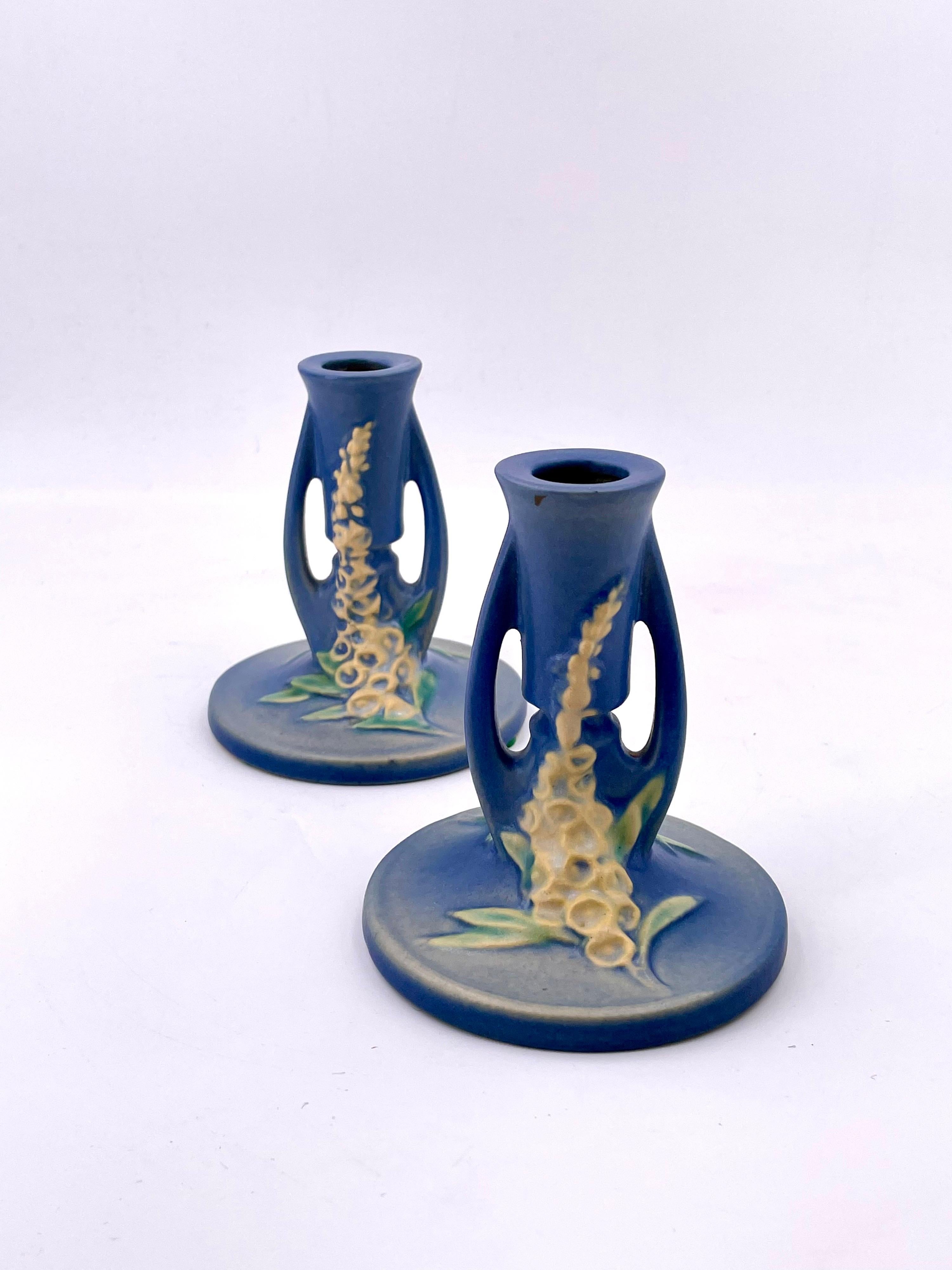 Roseville model 1150 pair of candlestick holders in beautiful blue glaze flower decorations, and side handles.