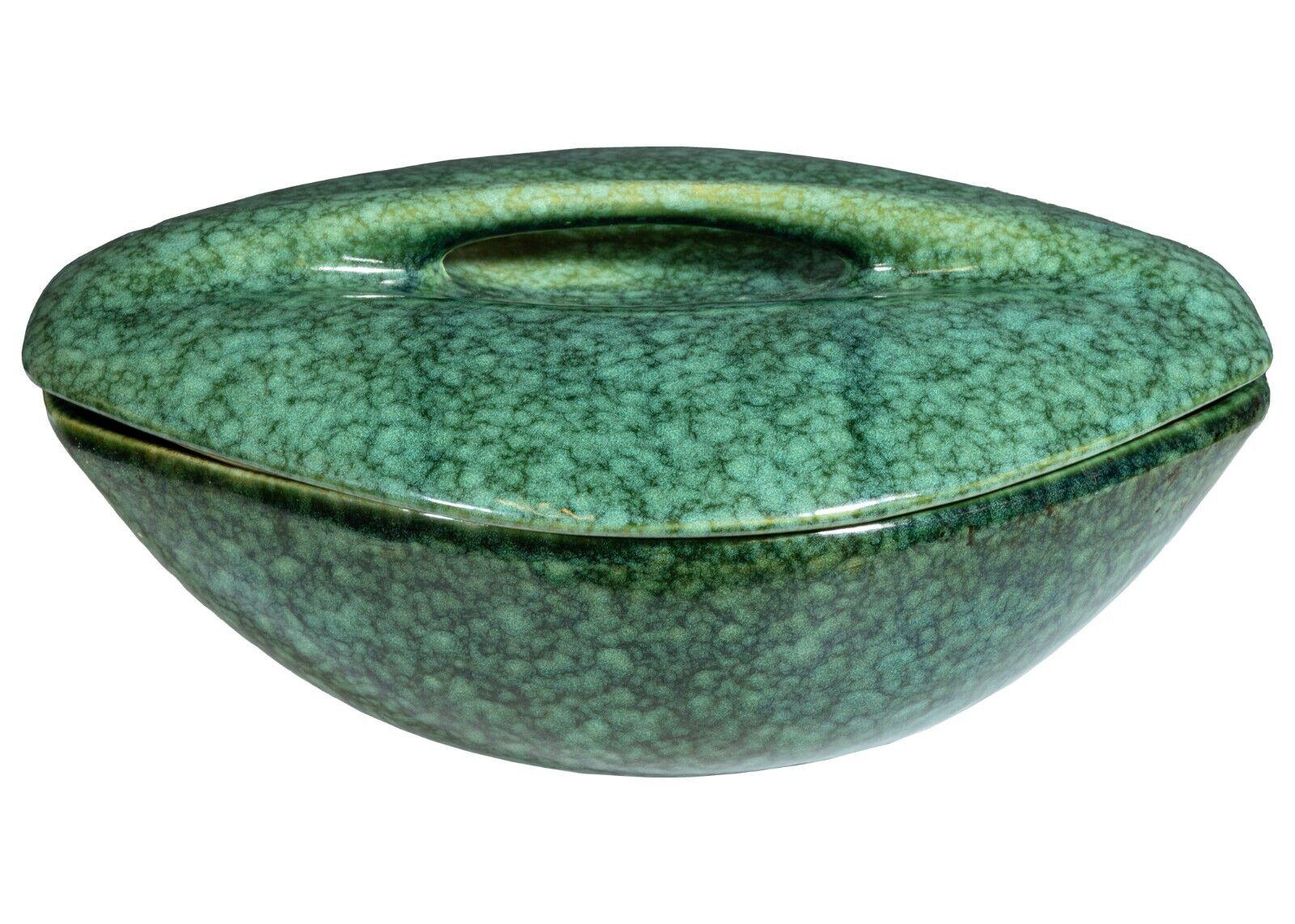 A Ben Seibel Raymor Roseville rare frogskin colored 37 pc set. This incredible set of pottery is designed by Ben Seibel for Roseville's Raymor collection. They are colored in a very rare frogskin-green color. They have a very pretty texture and