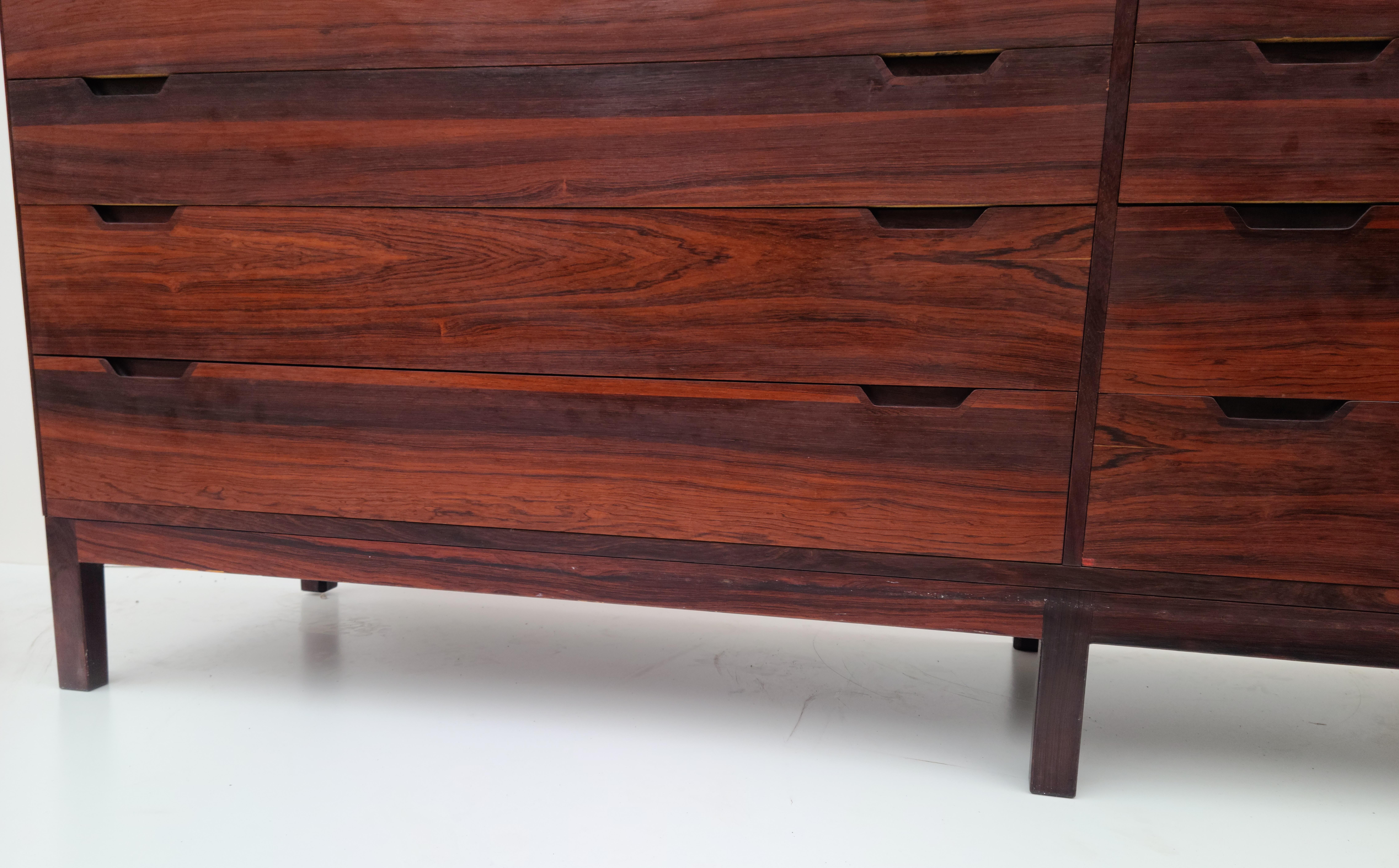 Please feel free to reach out for accurate shipping quote to your location.

Long Rosewood 8 drawer dresser designed by Svend Langkilde.
Made in Denmark by Langkilde Mobler.