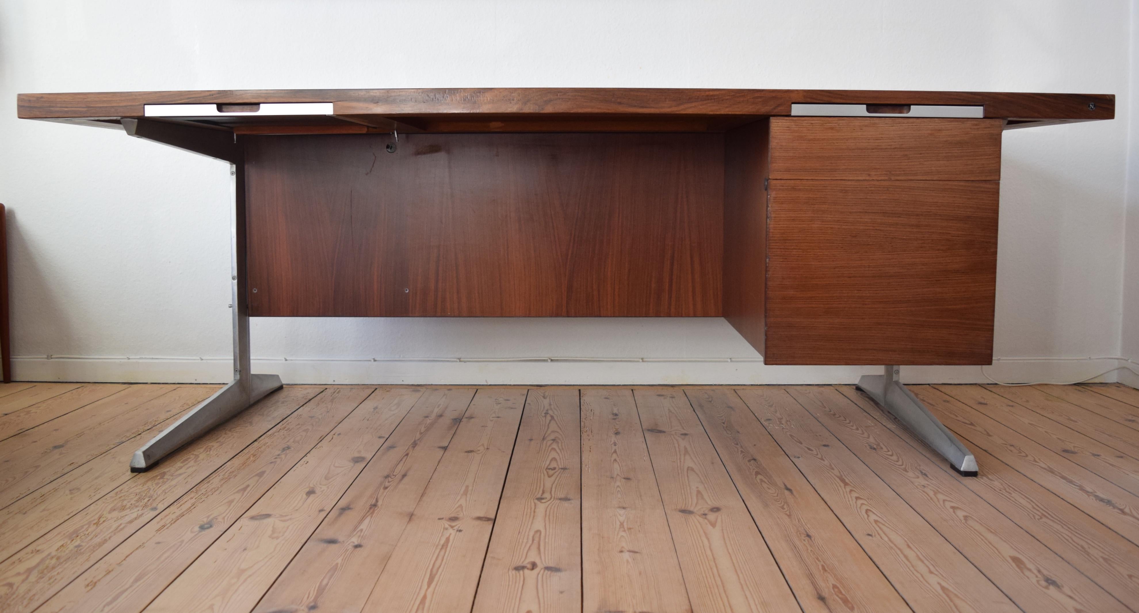 Large Danish rosewood executive desk designer by Marius Byrialsen for Nipu Møbelfabrik. The desk uses a modular system so various elements can be added or removed as required. With all the elements in place there would be two drawer sections on the