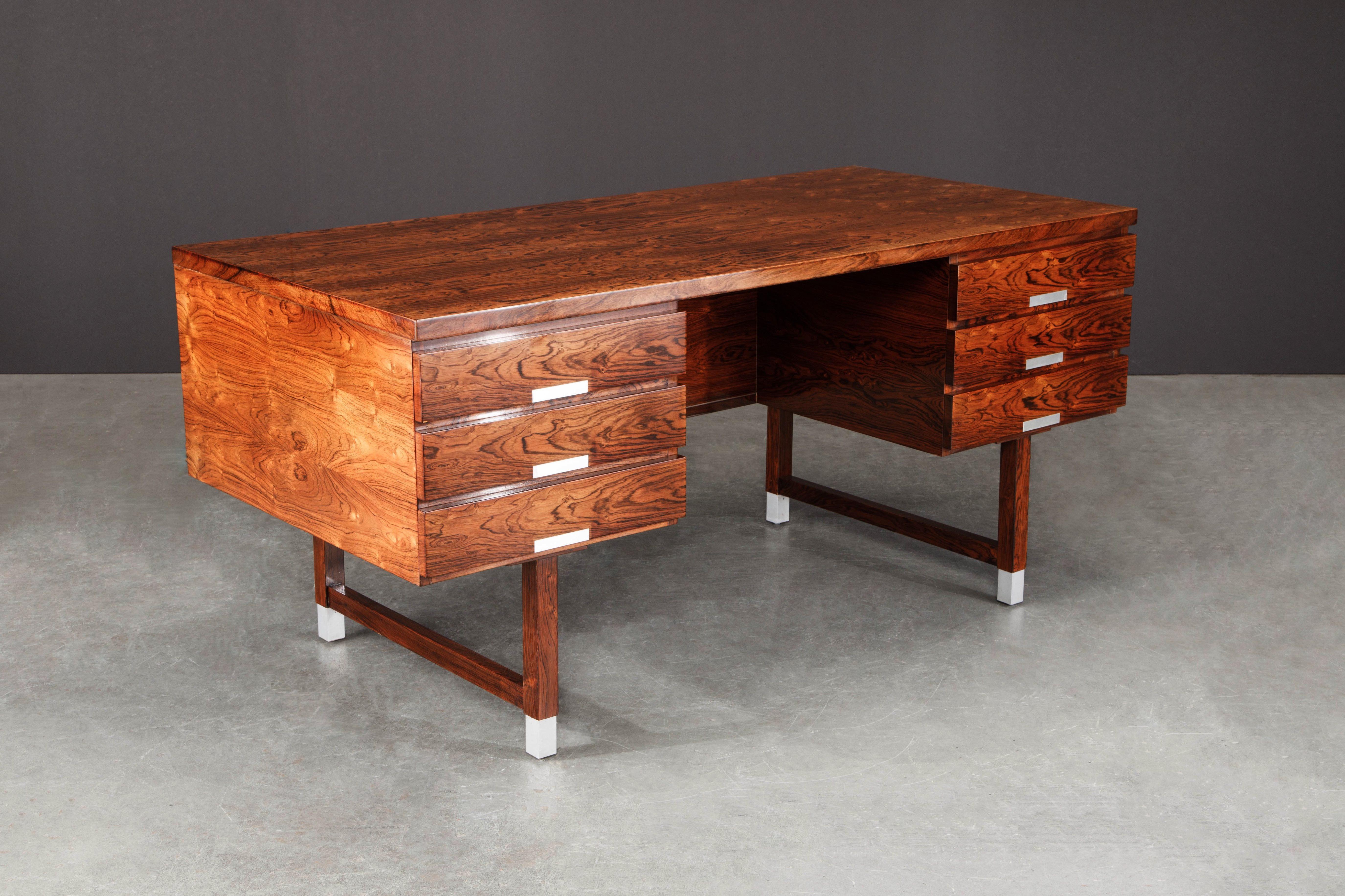 This gorgeous Rosewood and Aluminum desk by Kai Kristiansen for Feldballes Møbelfabrik was designed and produced in the 1960s, Denmark, and features incredible Brazilian Rosewood with vivid exotic grain which was beautifully refinished in a French