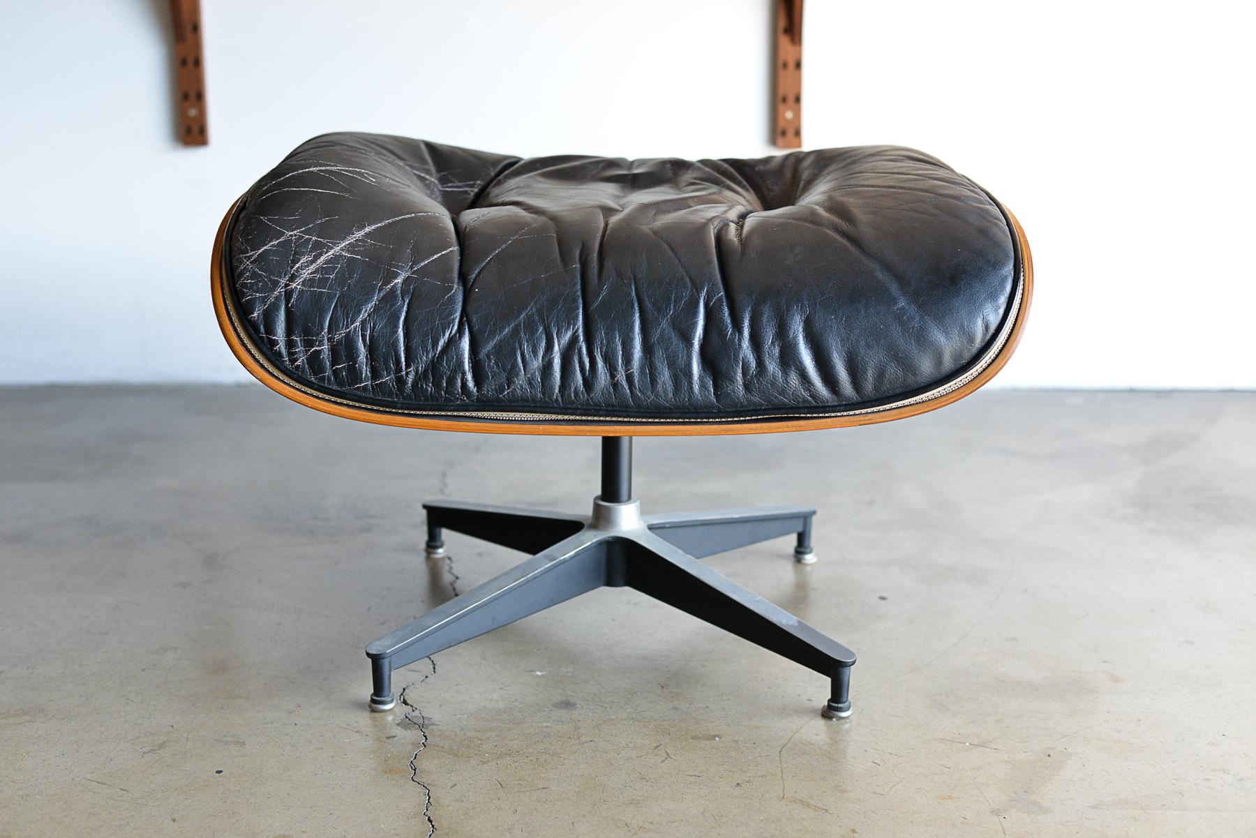 Rosewood and black leather Eames 671 ottoman, ca. 1970. 3rd generation rosewood and black leather Eames 671 ottoman. Good original condition with original leather and tags on underside. Great rosewood grain, can match an existing chair or replace