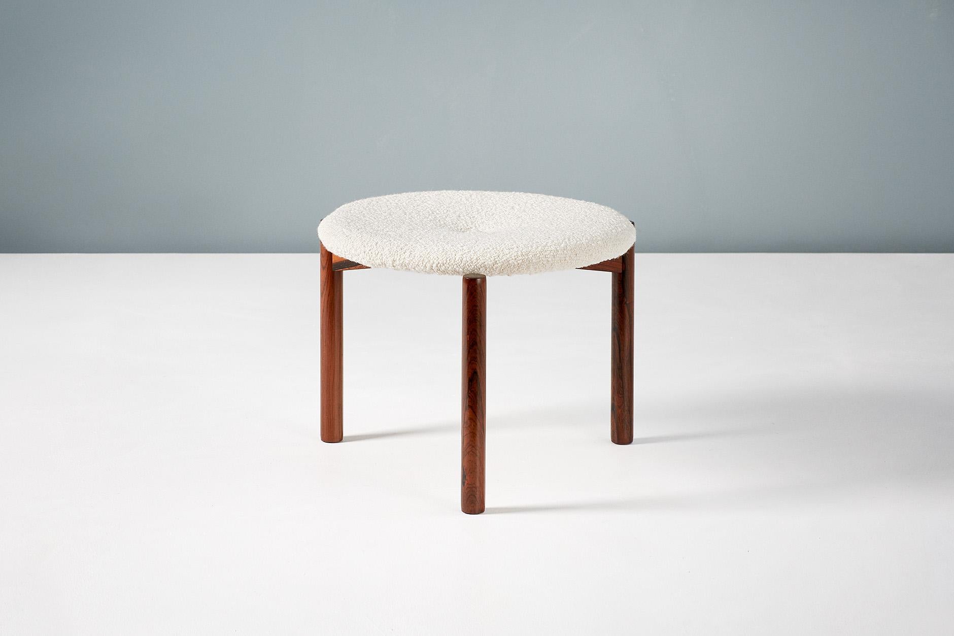 A matching pair of tri-leg rosewood stools by Swedish designer Uno Kristiansson. The seats have been reupholstered in new, luxurious boucle wool fabric. 



Swedish designers and brothers Uno & Östen Kristiansson, known for their lighting and