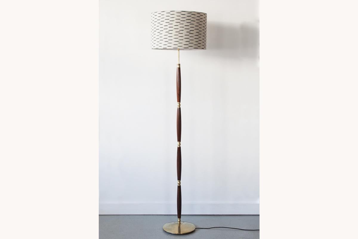 An elegant Danish floor lamp made from solid rosewood, with brass detailing and base. The top section is extendable to adjust the height of the lamp. Newly re-wired and PAT tested. Lampshade sold separately.

Dimensions: Height to bulb holder 140cm