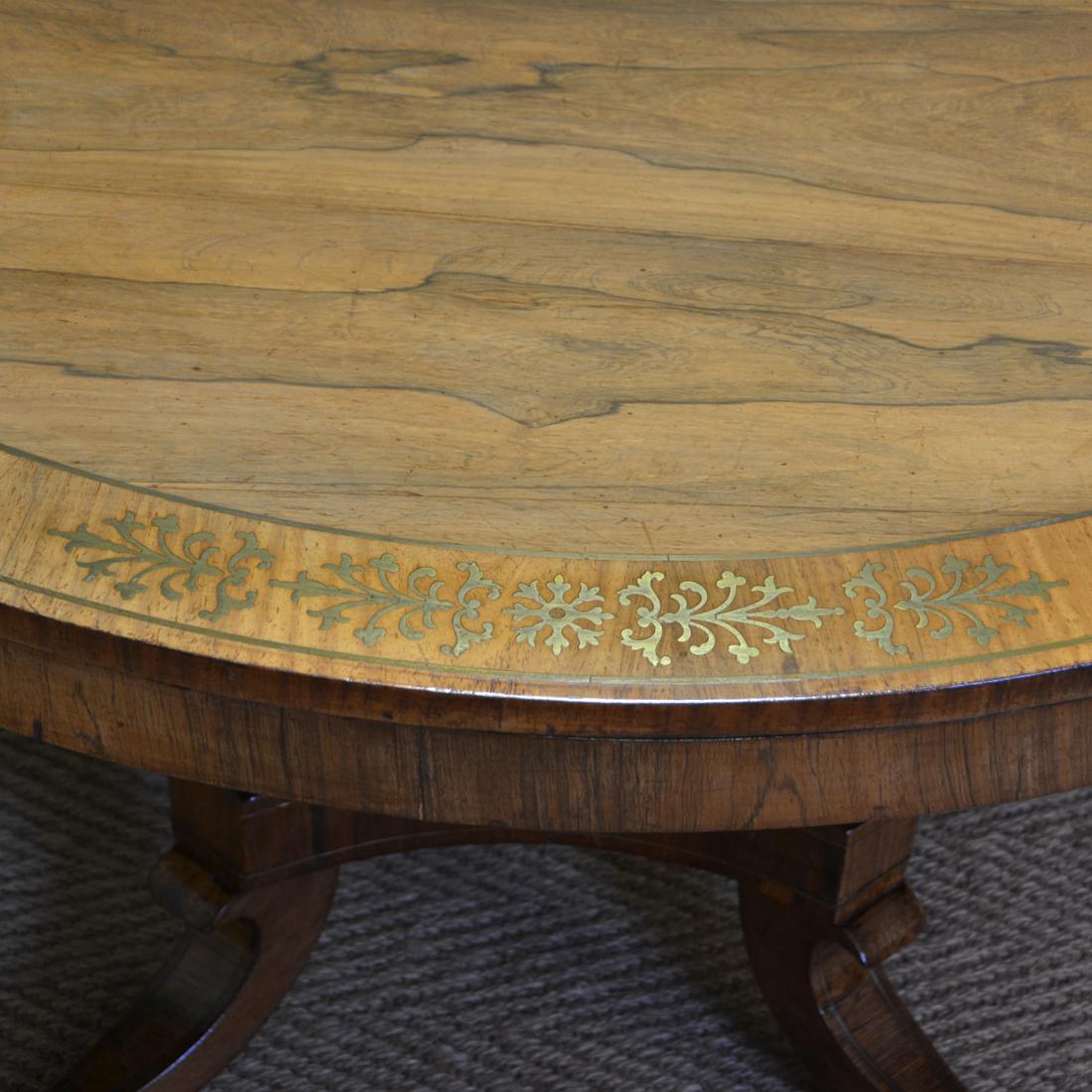 Spectacular mellow rosewood and brass inlaid Regency circular centre table.

Of magnificent quality and extremely unusual with brass inlay, this Regency circular centre table dates from circa 1830. It has a circular beautifully figured top which