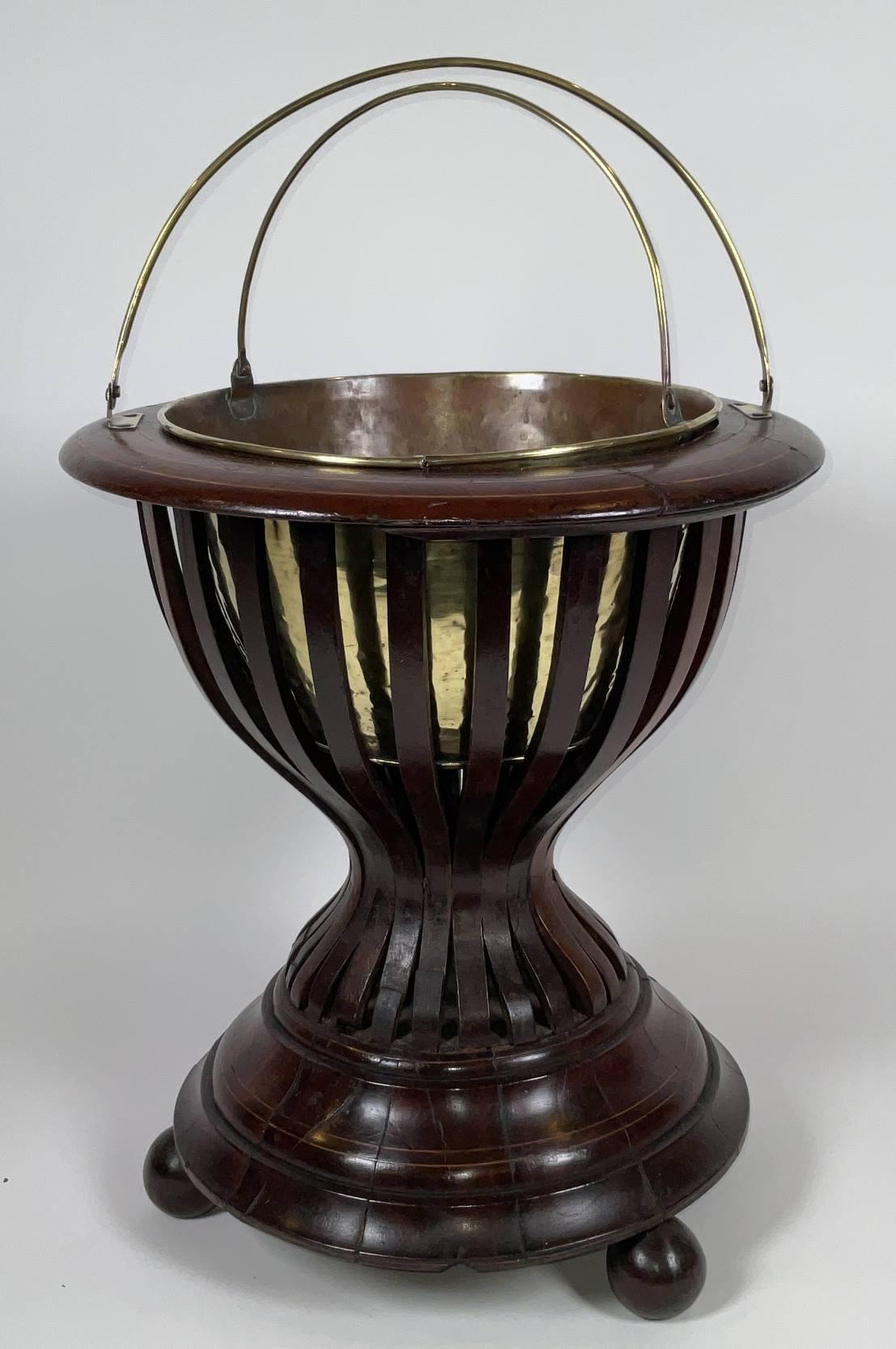 Victorian English planter with satinwood inlay. Liftout brass pail and brass carry handle. Note: Cracks and splits. With four turned feet. 17