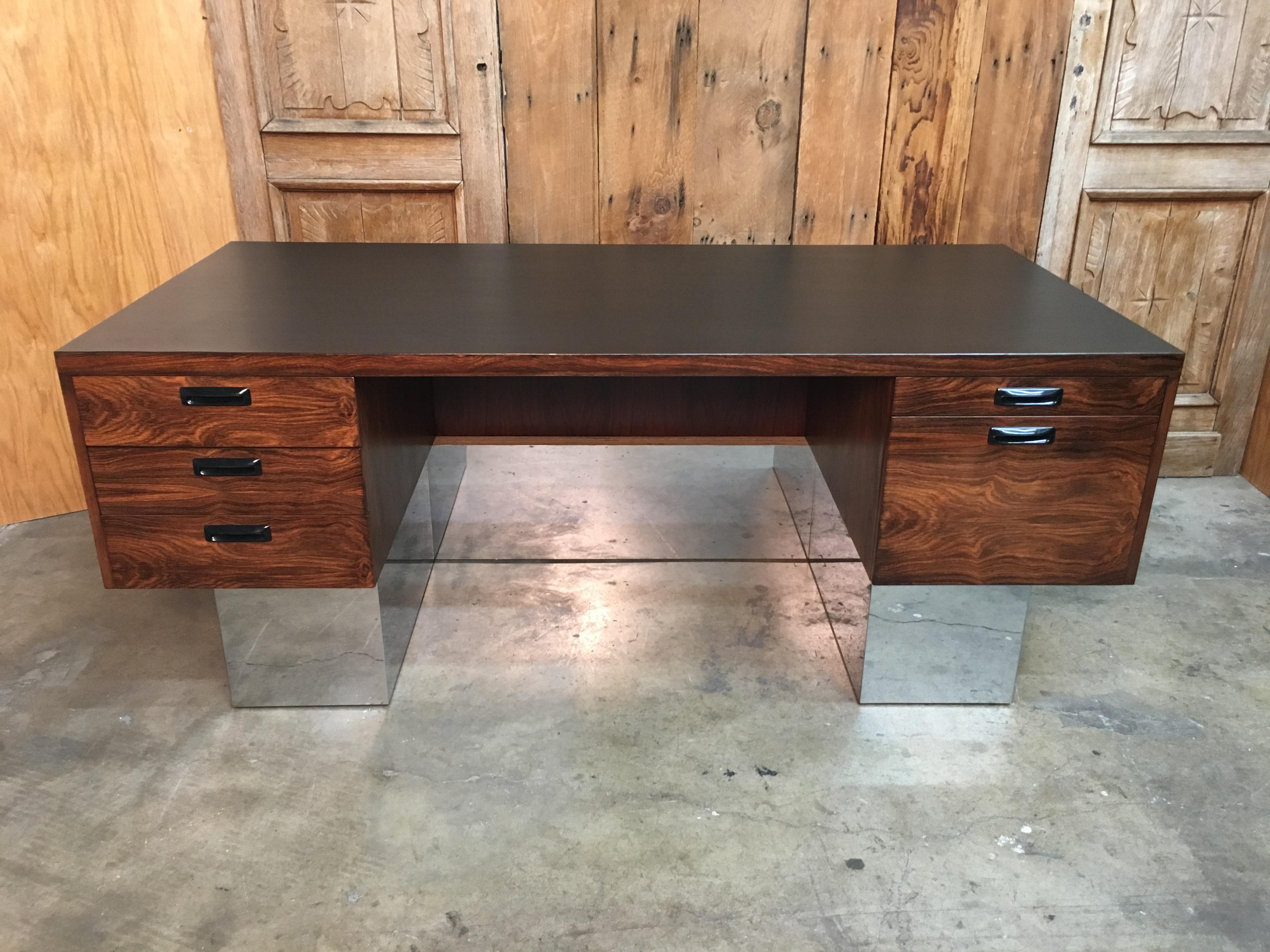 Rosewood and chrome executive desk with ebonized wood top.