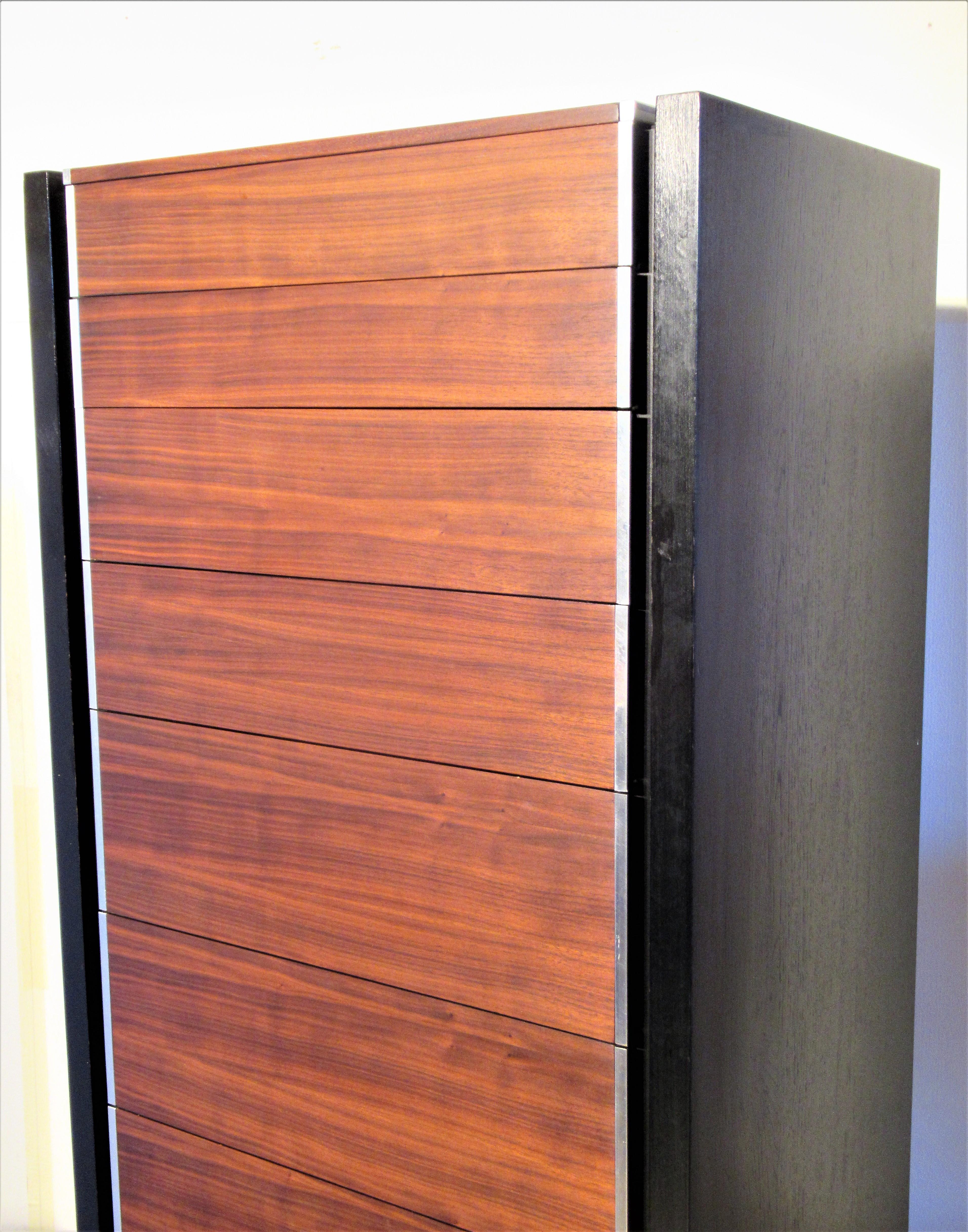 A hard to find eight-drawer tall and narrow lingerie chest by Glenn of California with rosewood and finely machined chromed steel drawers and ebonized sides with beautiful underlying grain to wood. Circa 1960s. Look at all pictures and read