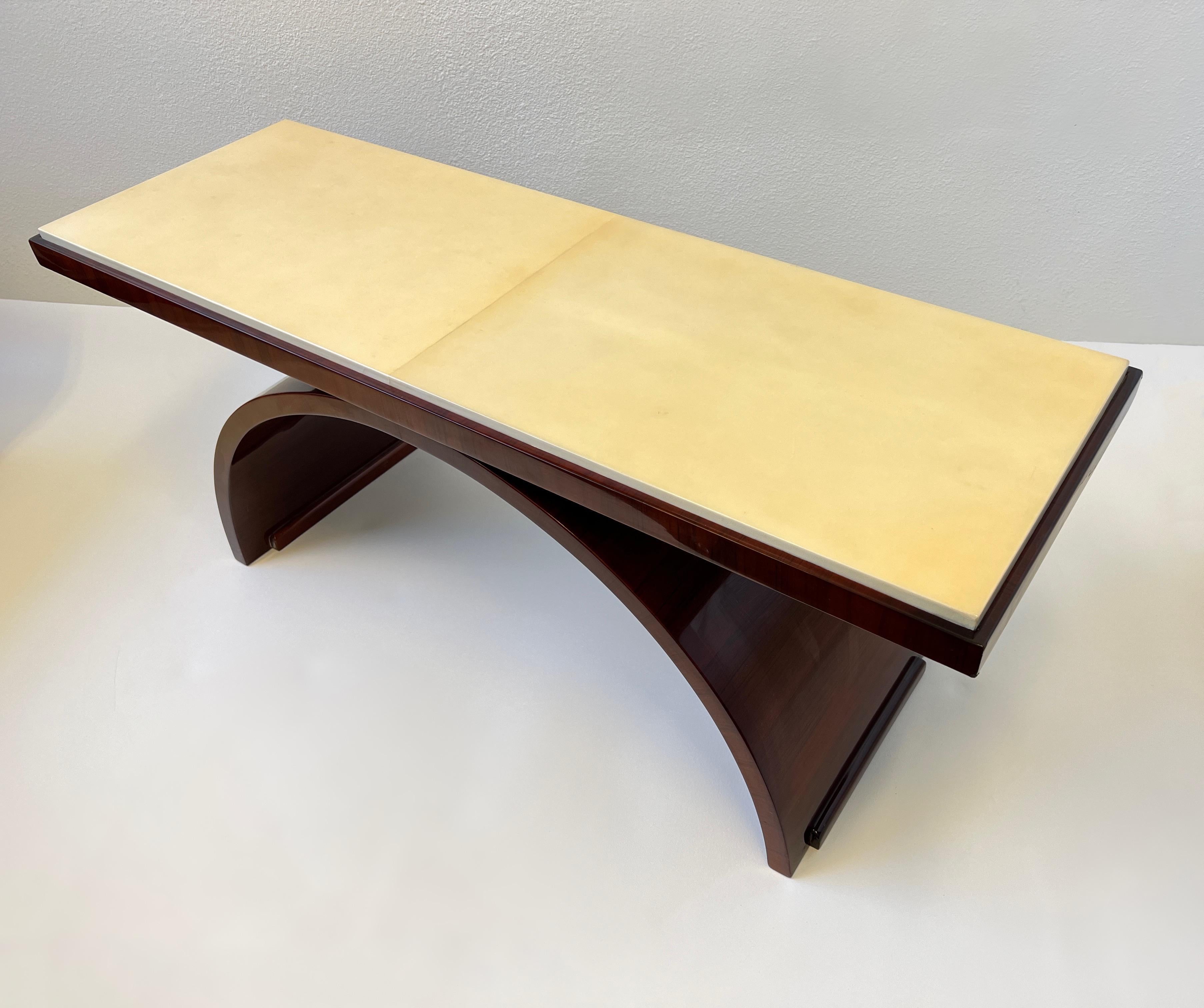 A beautiful Italian rosewood and Goatskin parchment paper Art Deco Coffee Table.
Constructed of rosewood veneer with a goatskin parchment paper top and finish with a thick clear lacquered.
Not sure if the lacquer was refinish, we had it