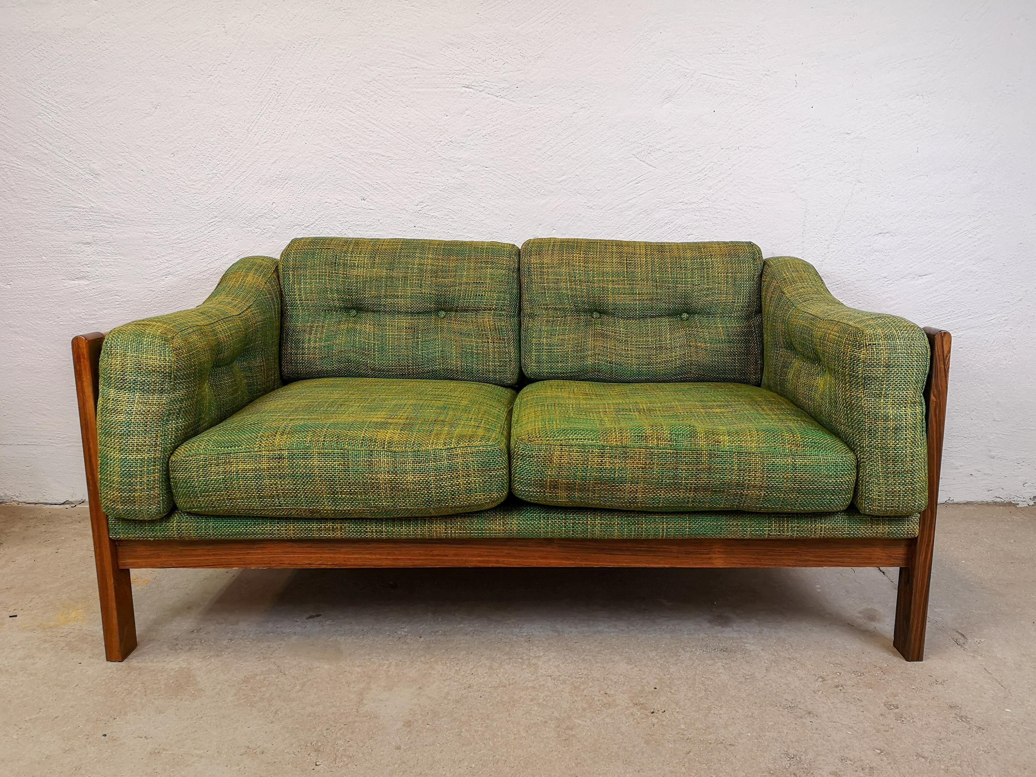 This 2-seat sofa made in Sweden for Futura Furniture in the 1960s, is made in rosewood and have green cushions seats.
Because of the expensive manufacturing it was only produced in 2 years. Designed by Ingvar Stockum.

Good