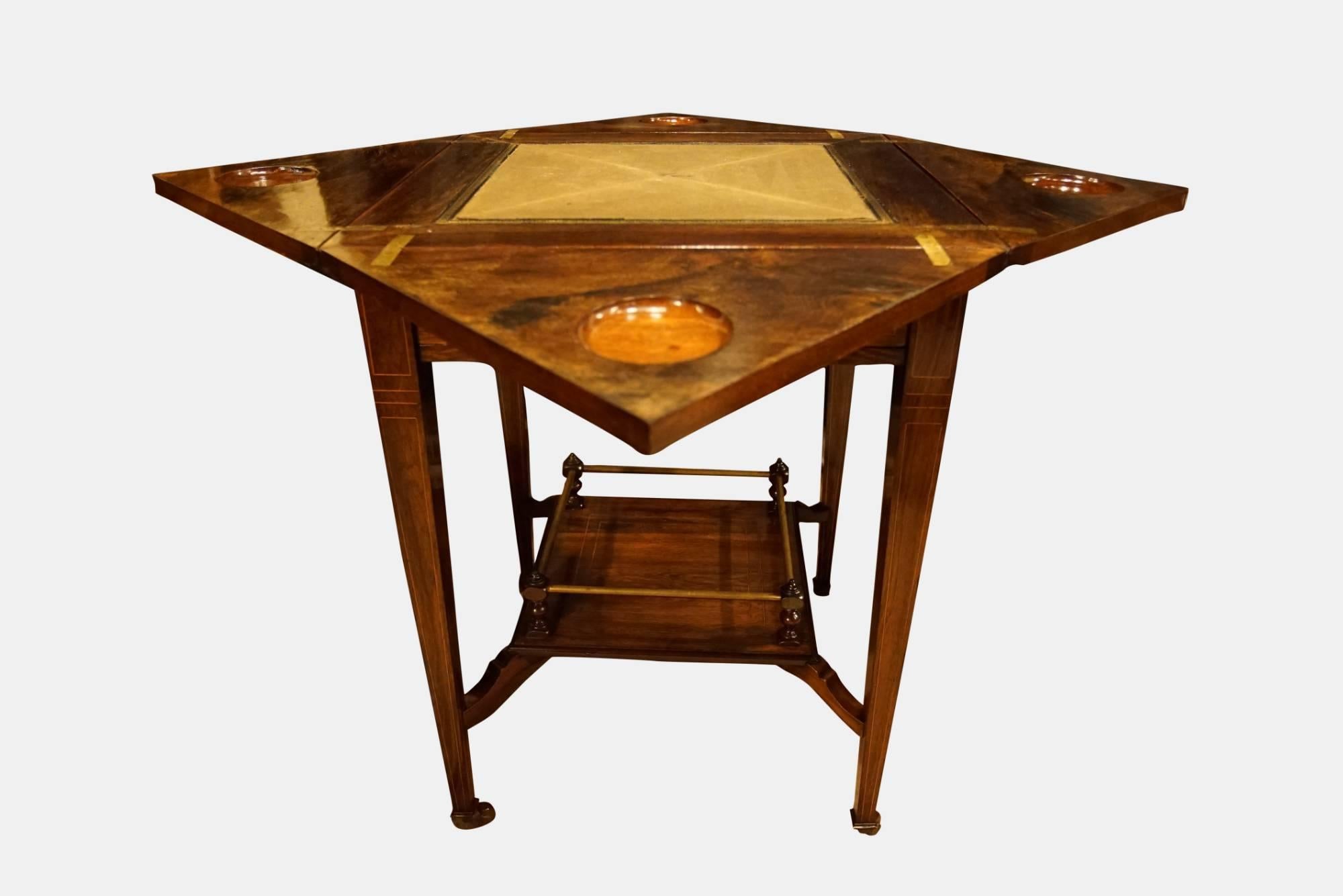 A rosewood and inlay envelope card or games table

circa 1880.