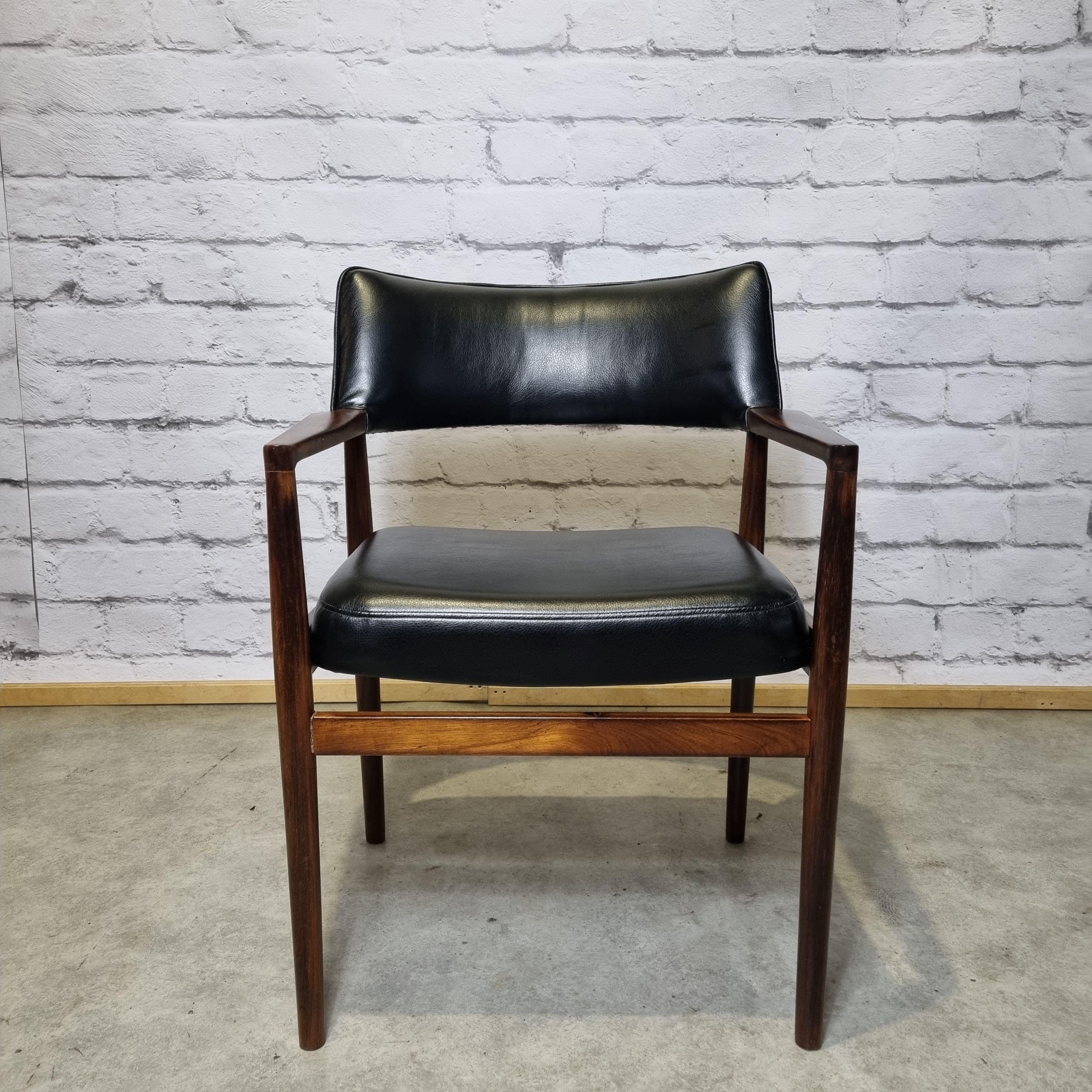 Beautiful scandinavian armchair. Solid rio rosewood frame and leatherette seat and back, new reupholstered. Very elegant furniture listed by the design museum denmark under the number rp03700. Rare piece of designe.