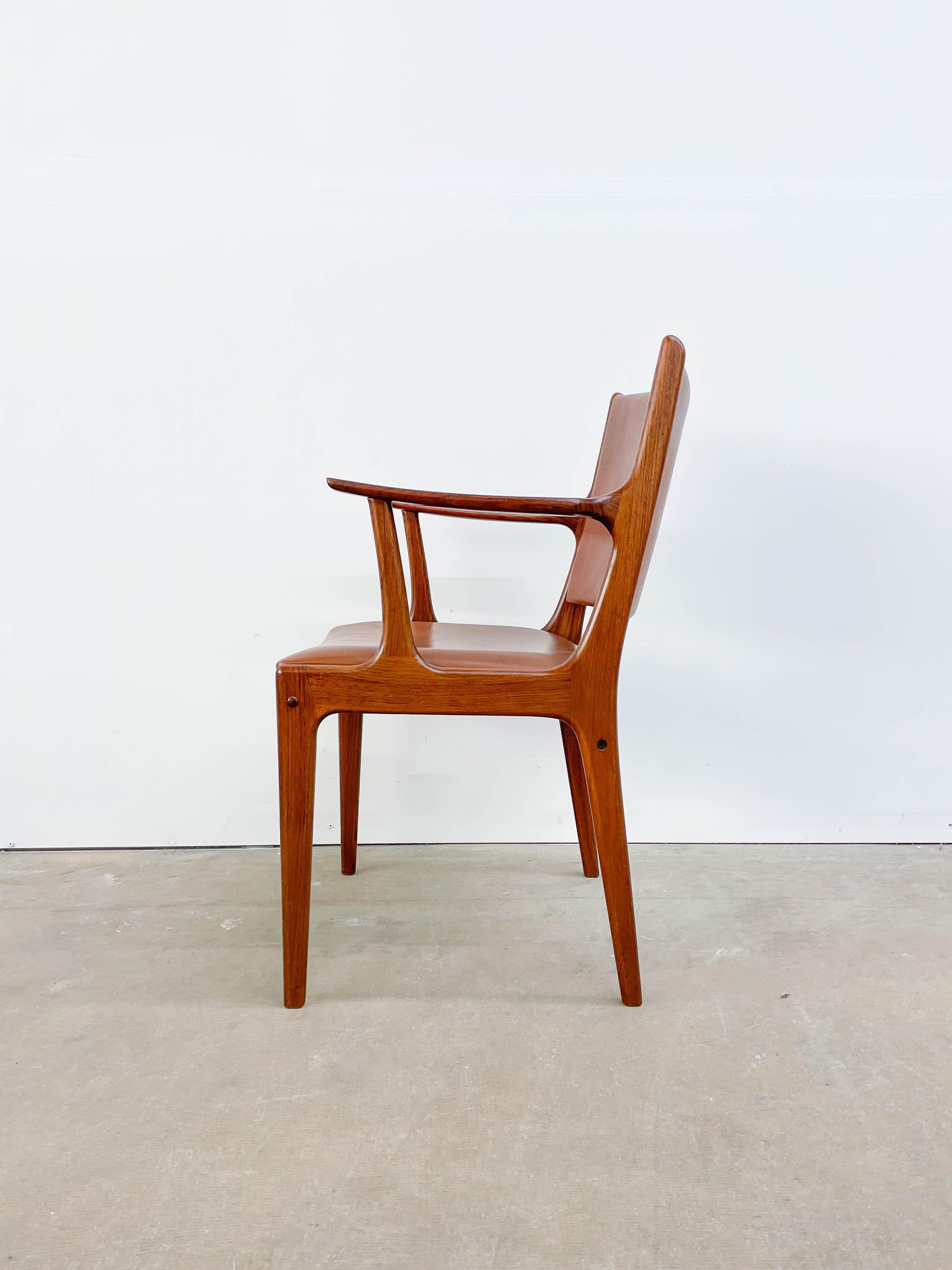This solid rosewood armchair with leather seat and back was designed by Johannes and Eva Andersen in the 1960s. The chair is in very good vintage condition with a nice patina on the leather. The occasional marks on the seat and minimal signs of wear