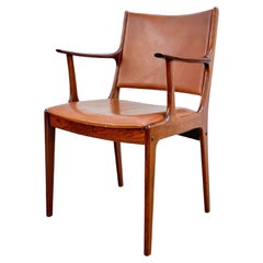 Fauteuil en bois de rose et cuir de Johannes Anderson