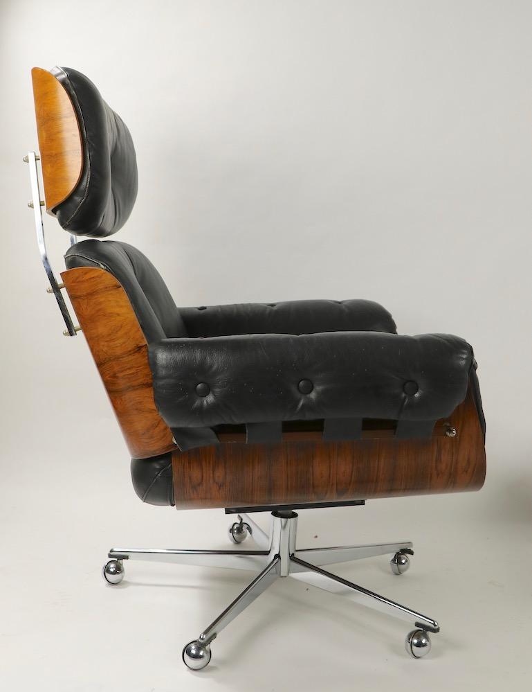 Mid-Century Modern Rosewood and Leather Eames Style Swivel Lounge Chair and Ottoman