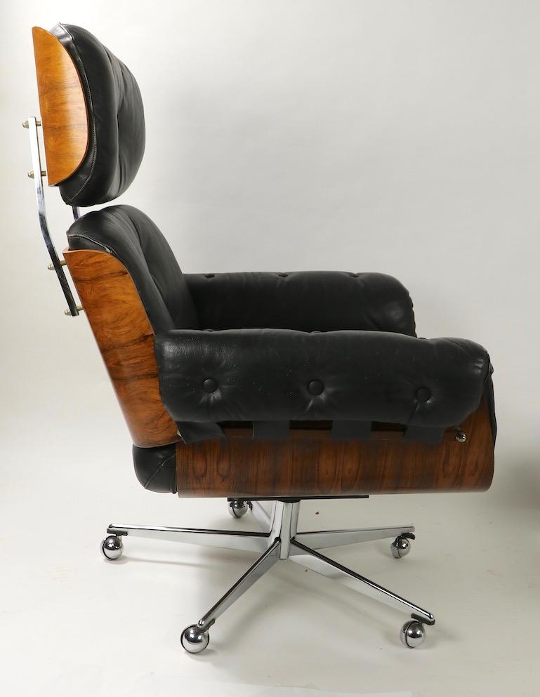 German Rosewood and Leather Eames Style Swivel Lounge Chair and Ottoman