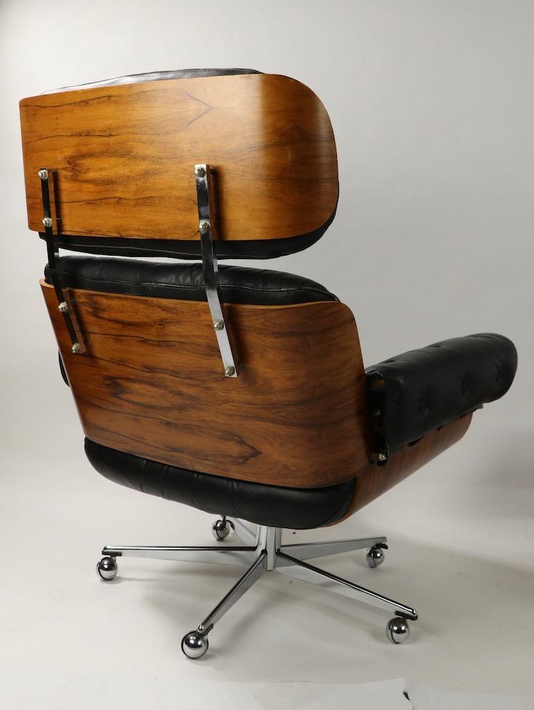 Rosewood and Leather Eames Style Swivel Lounge Chair and Ottoman In Good Condition In New York, NY