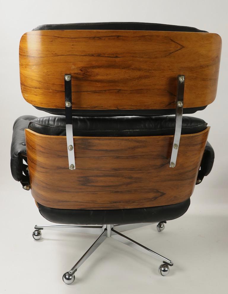 20th Century Rosewood and Leather Eames Style Swivel Lounge Chair and Ottoman