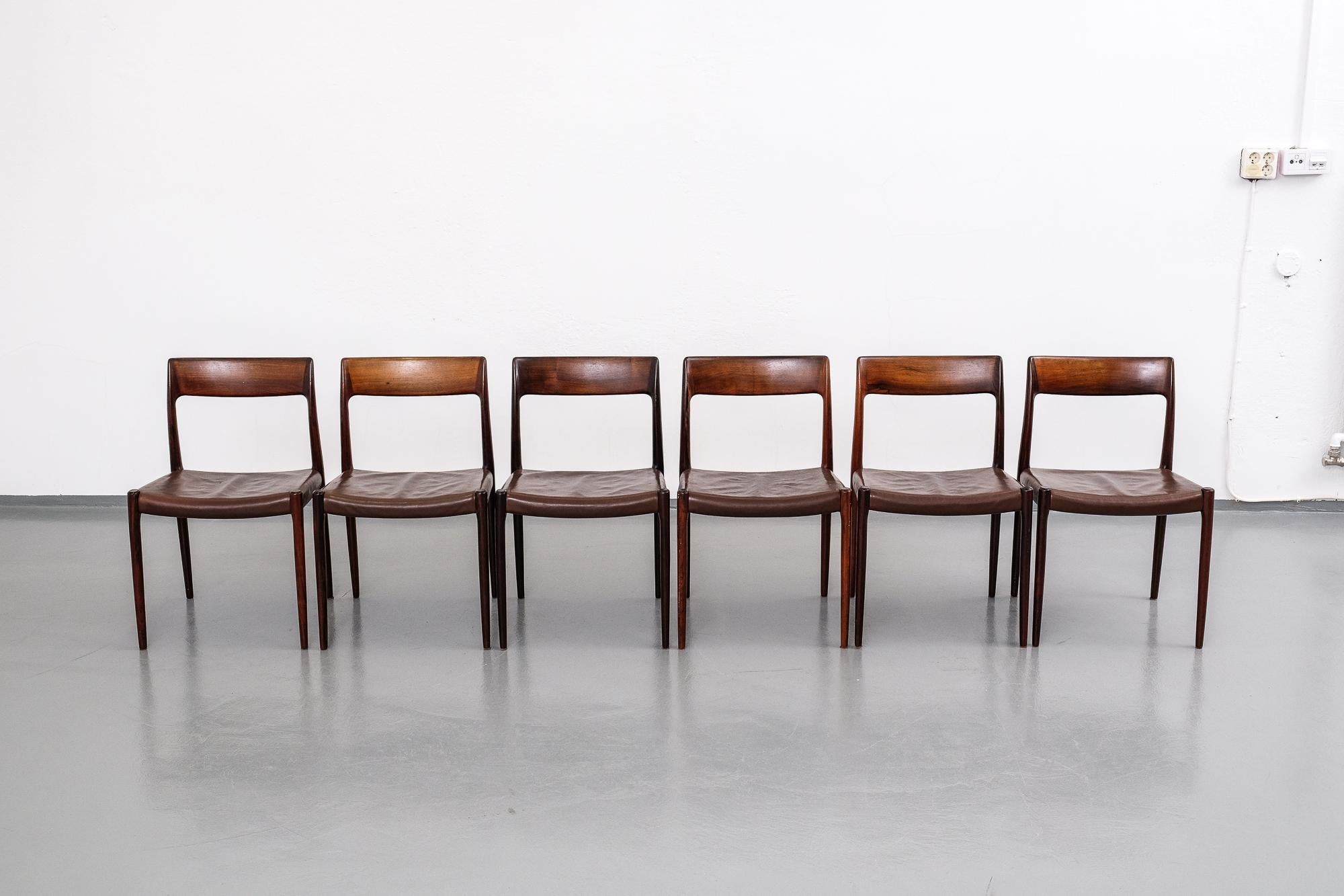 Beautiful set of six model #77 dining chairs designed by Niels Otto Møller and produced by J.L. Møllers Møbelfabrik in the 1960s. Frames are made from solid rosewood and have original brown leather upholstery.

Shipping to continental Europe only