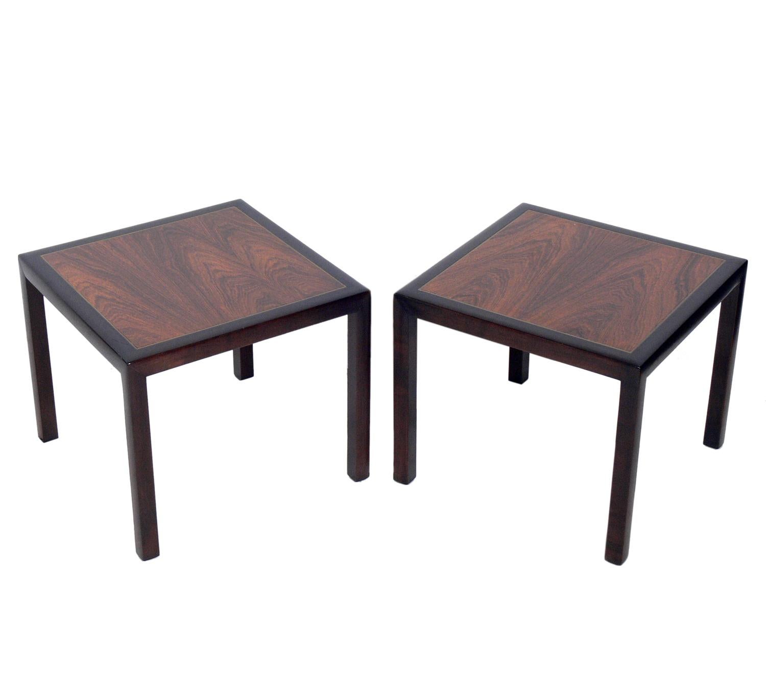 Rosewood and mahogany with brass inlay end tables, attributed to Dunbar, unsigned, American, circa 1950s. They are a versatile size and can be used as end or side tables, or as night stands.
