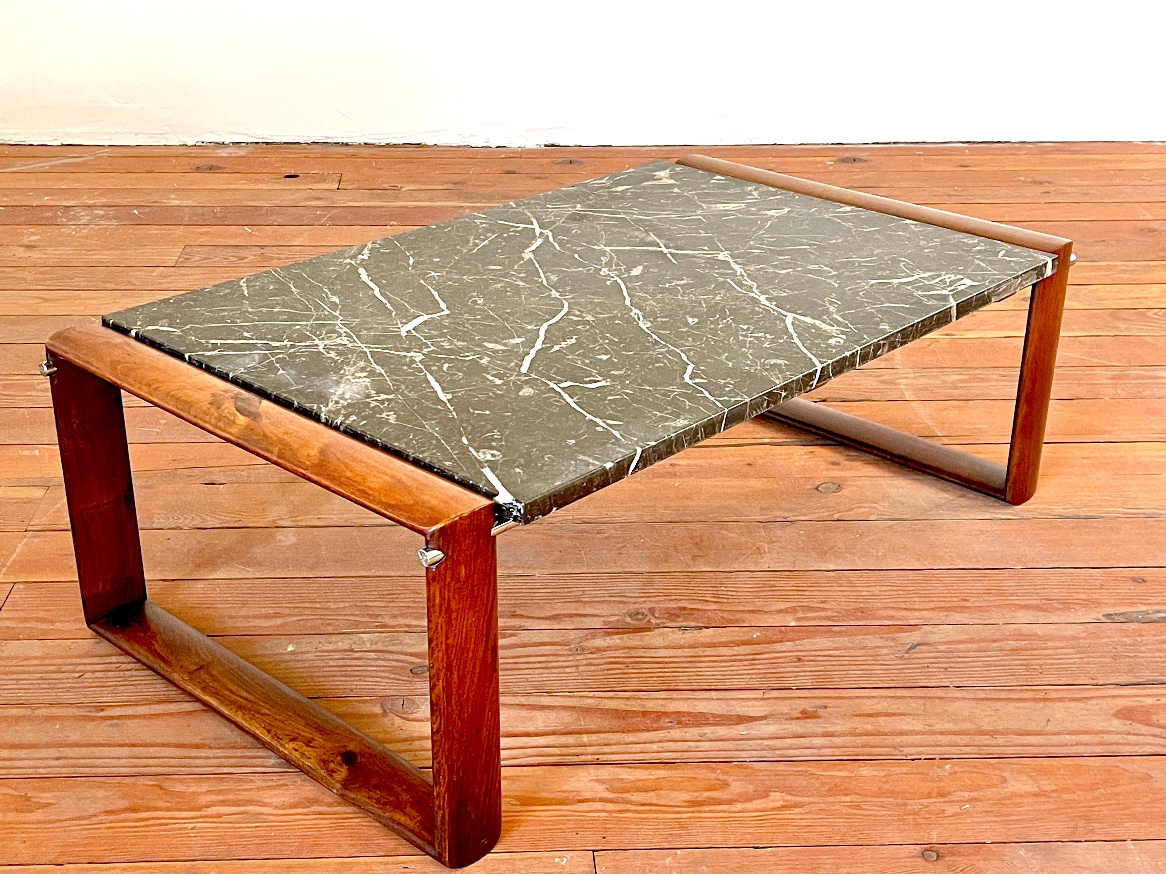 Handsome black Marquina marble coffee table with rosewood frame and aluminum hardware. 
Wonderful patina.