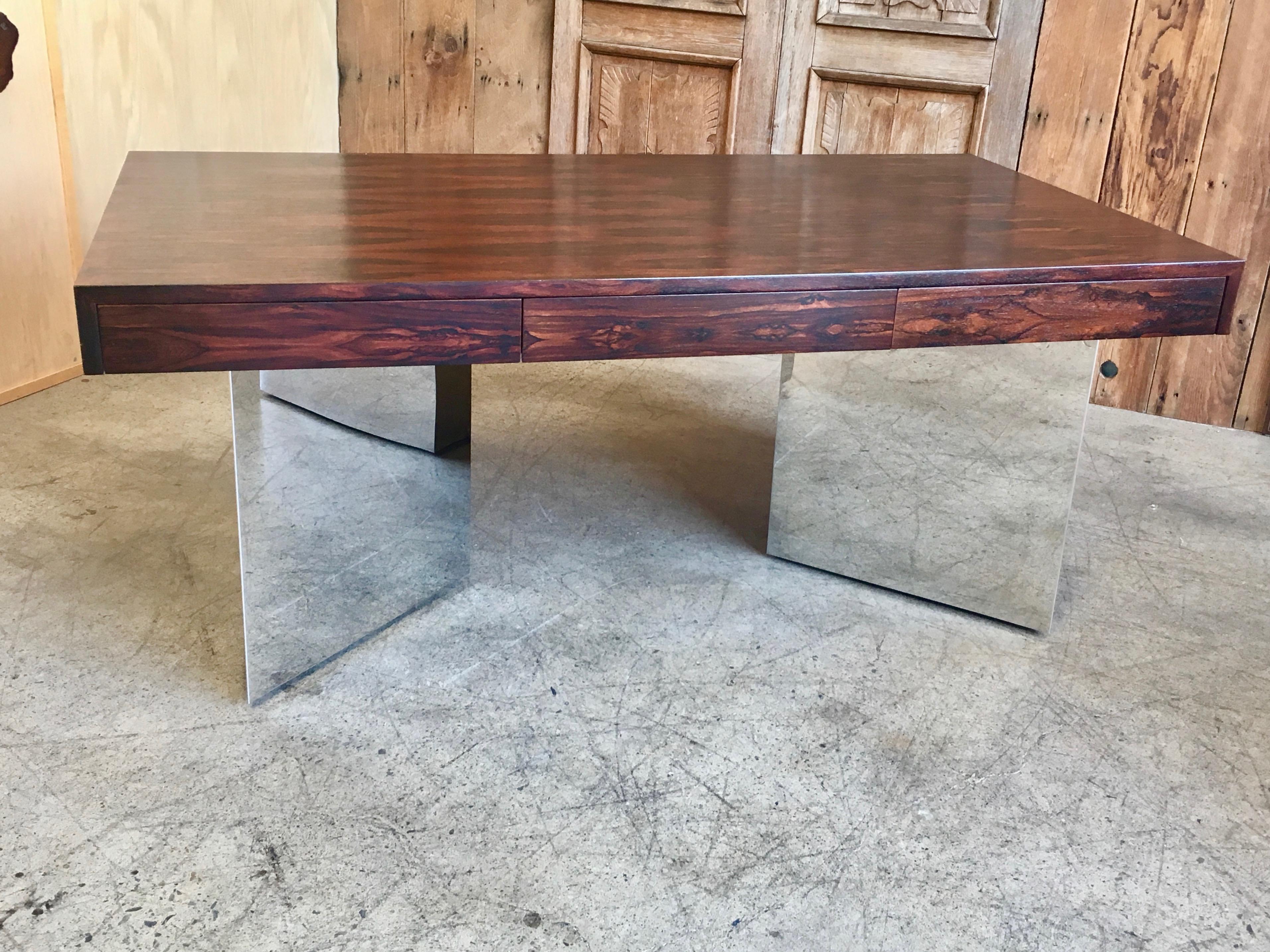 Rosewood and mirror polished stainless steel executive desk by Pace collection. Highly figured rosewood grain to the top. This piece has been professionally restored.