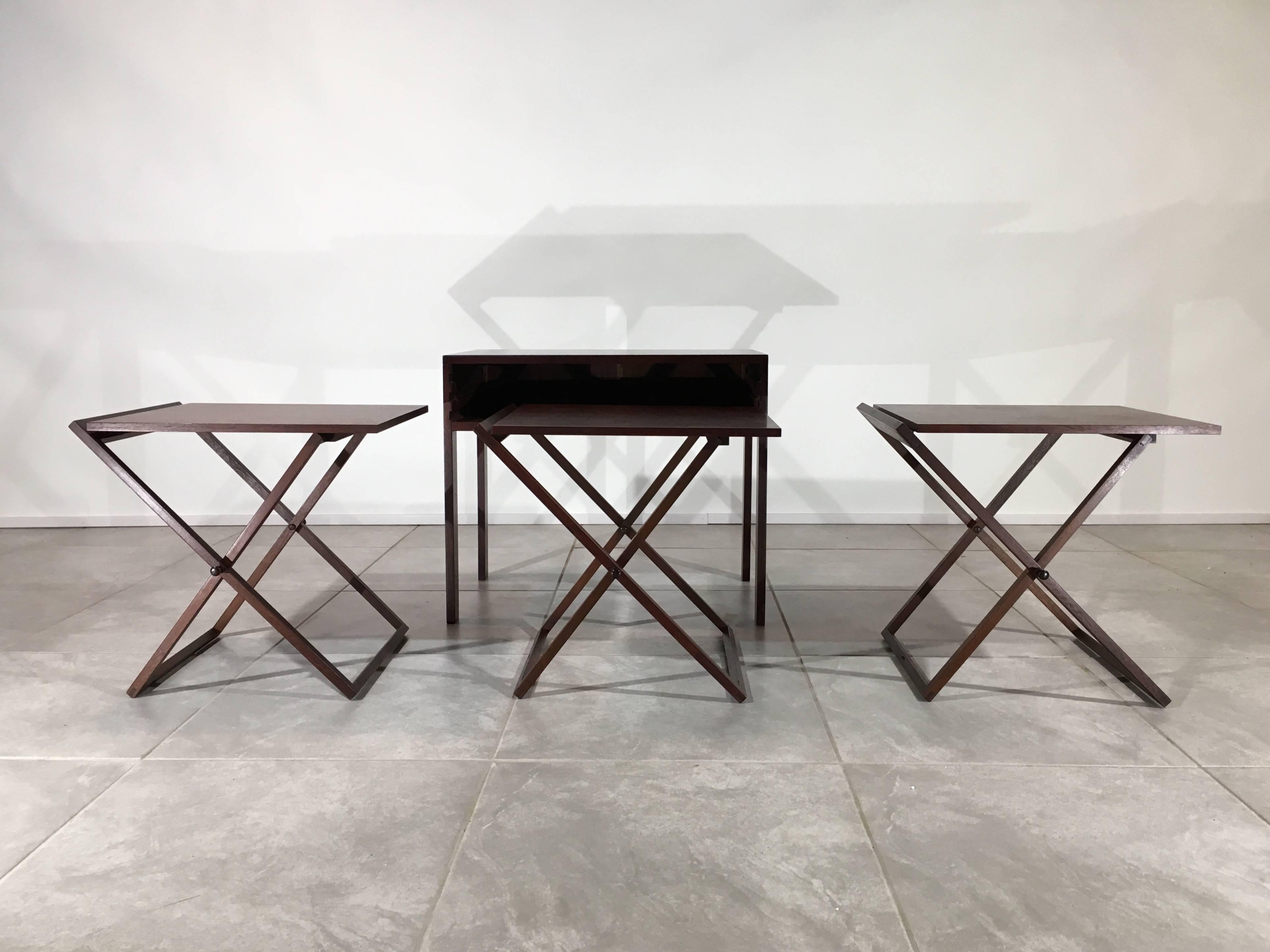 Beautiful set of three cased nesting tables in rosewood and oak designed by Illum Wikkelso for Silkeborg, Denmark, circa 1960.
 