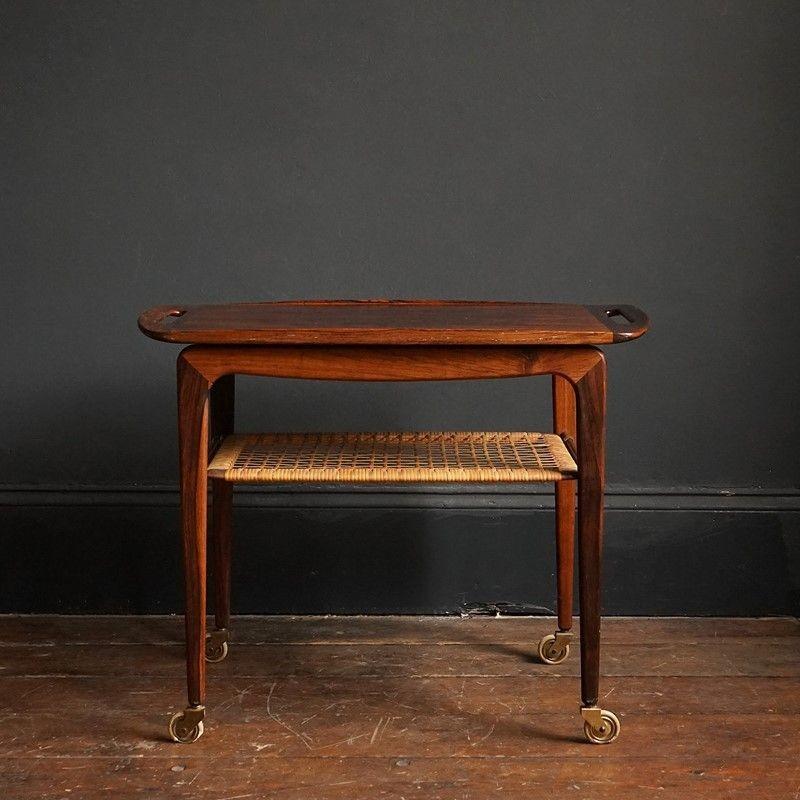 Mid-Century Danish Serving Side Table With Removable Tray, 1960s

Elegant timeless design by renowned Danish designer Johannes Andersen.

Made in Denmark from Brazilian rosewood. CITES certificate number 602426/01 certificate present for the legal