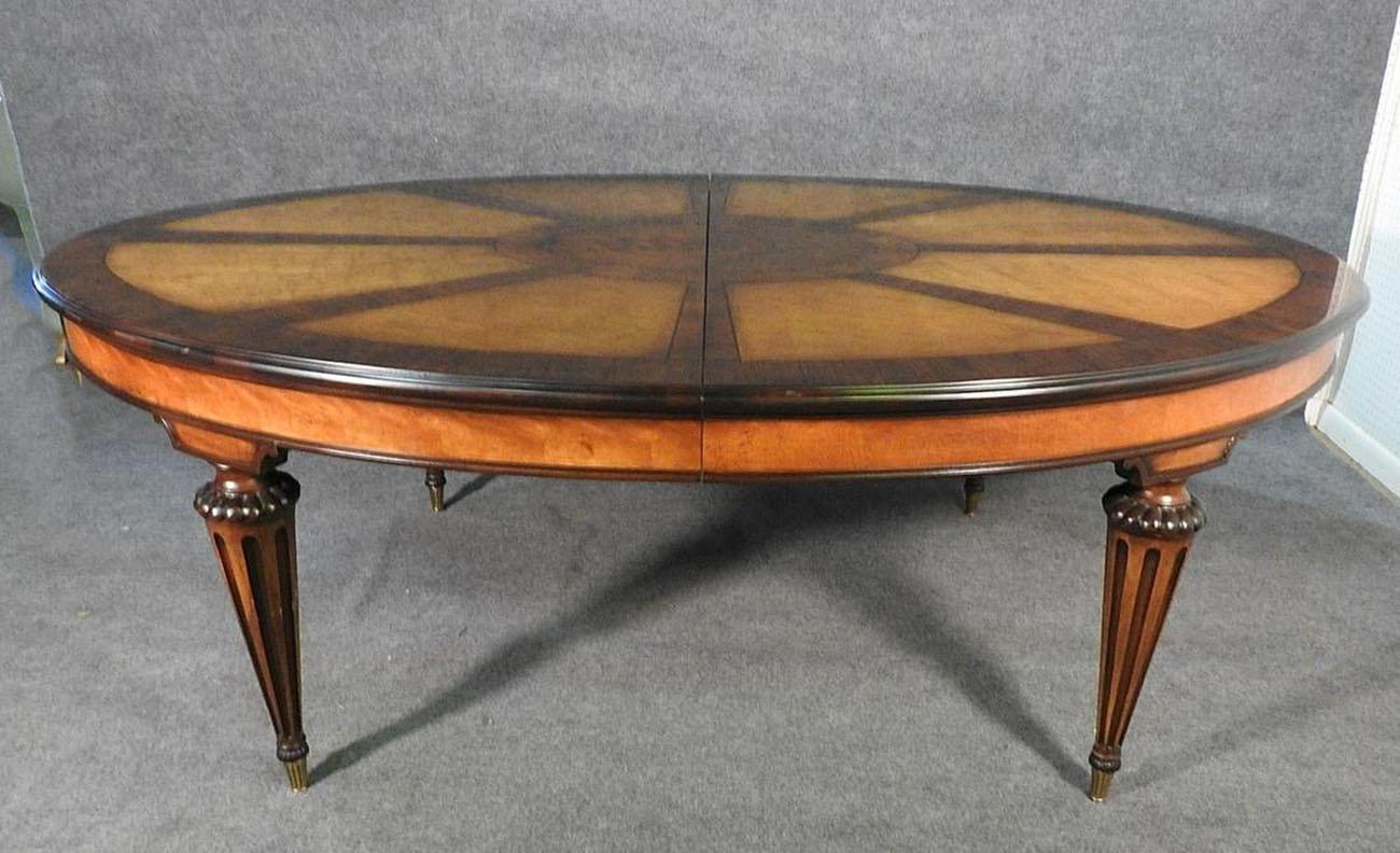 This is a superb dining table by the world famous manufactuer E.J. Victor. The table is in good used condition with some minor signs of use but is in fundamentally good condition. There are 3 leaves of 22 inches each for a total possible length of