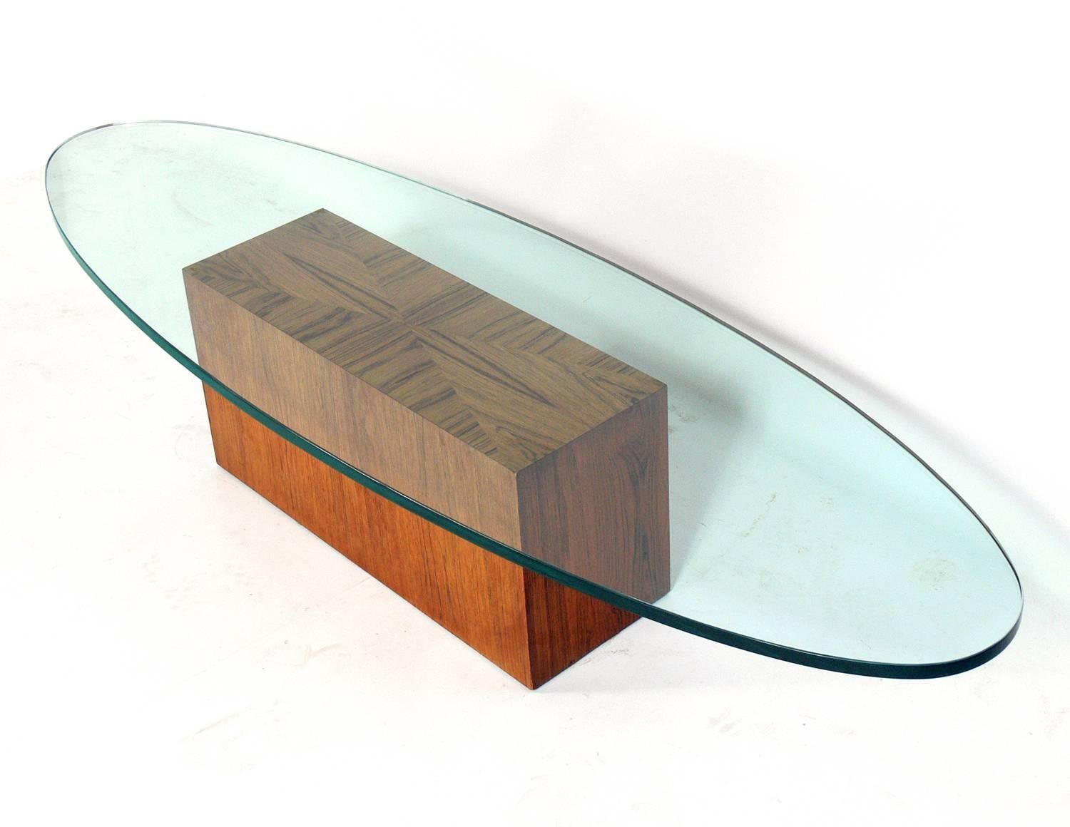 Rosewood and surfboard glass coffee table, designed by Harvey Probber, American, circa 1960s.