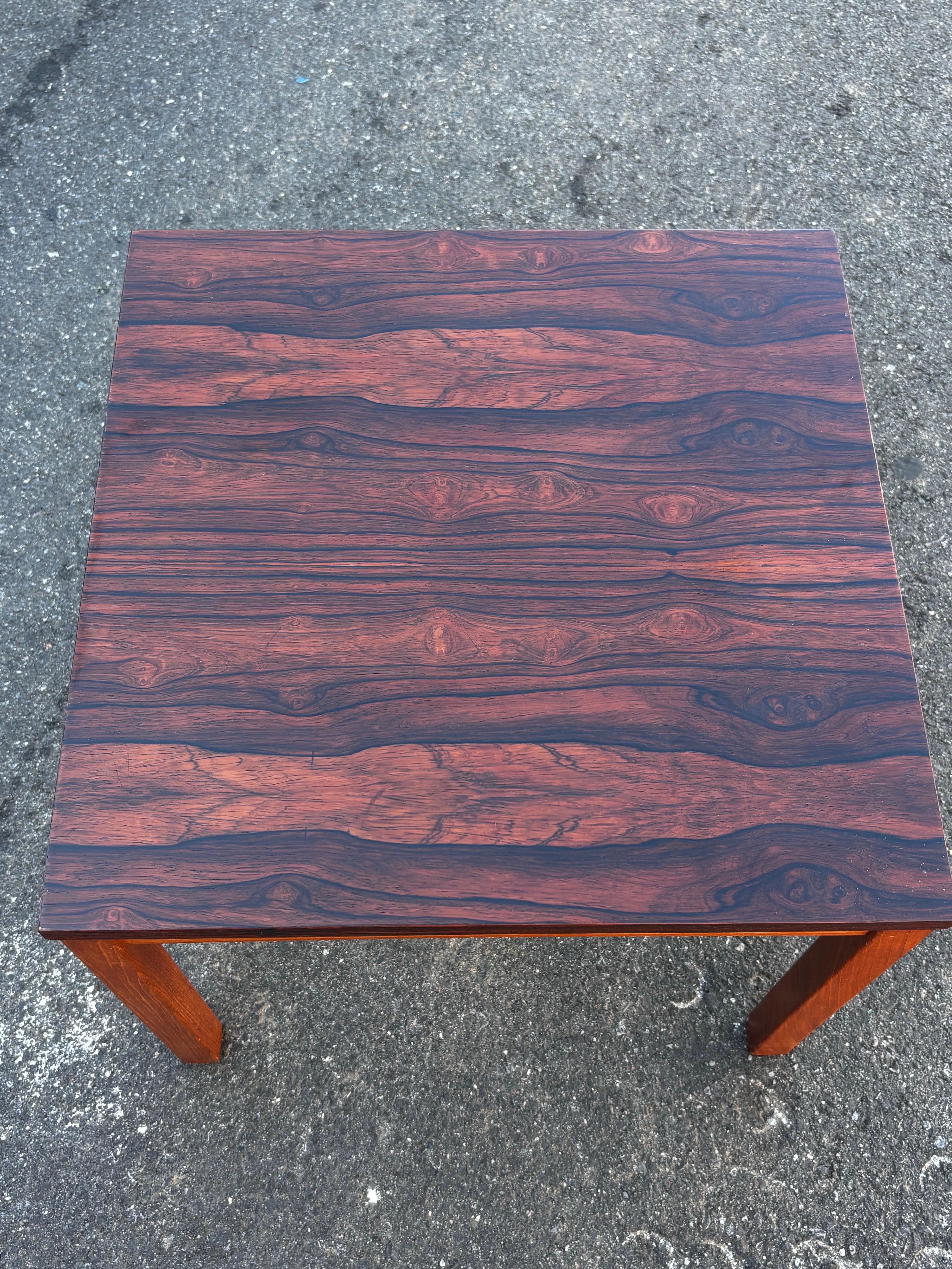 Danish Rosewood topped table with teak legs, nice pairing of woods that elevate this simple table!  Top refinished