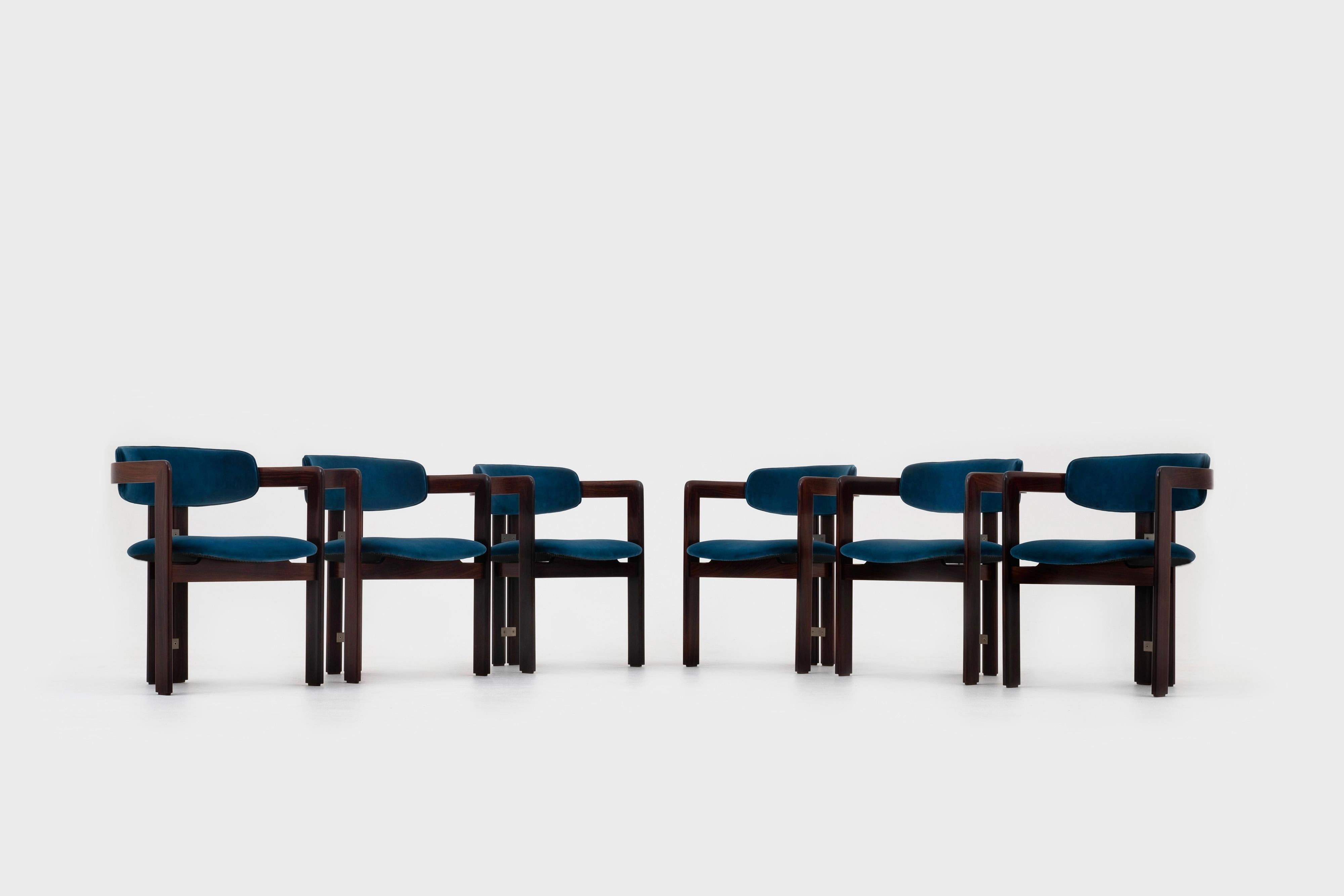 Set of six 'Pamplona' dining chairs by Augusto Savini for Pozzi, Italy, 1960s. This is for the rare early model in solid rosewood. By far the most beautiful and luxurious model. The chairs have a strong sculptural design with beautiful details such