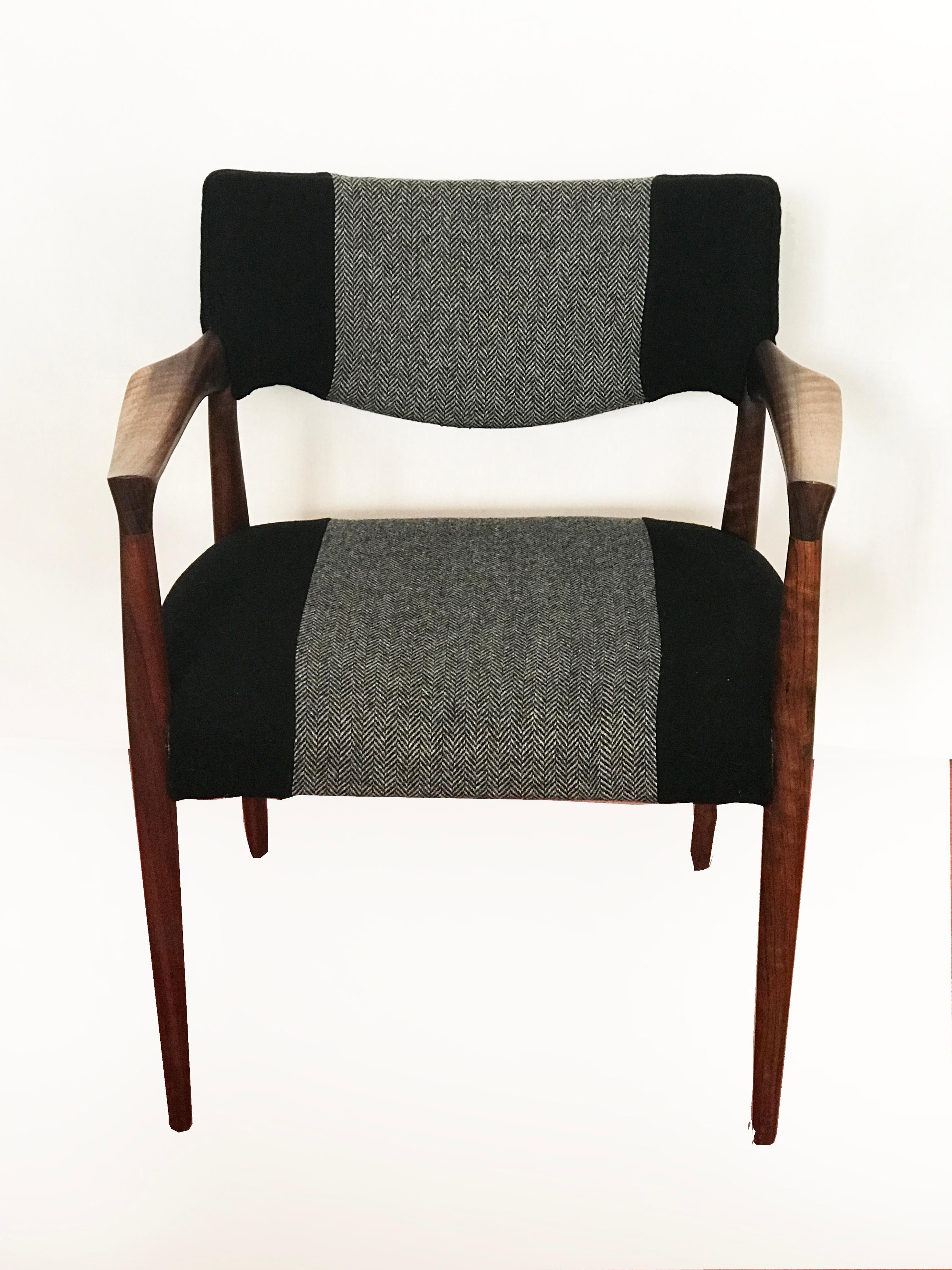 Beautiful rosewood armchair recently upholstered in black wool and black and white sprig pattern. 
 