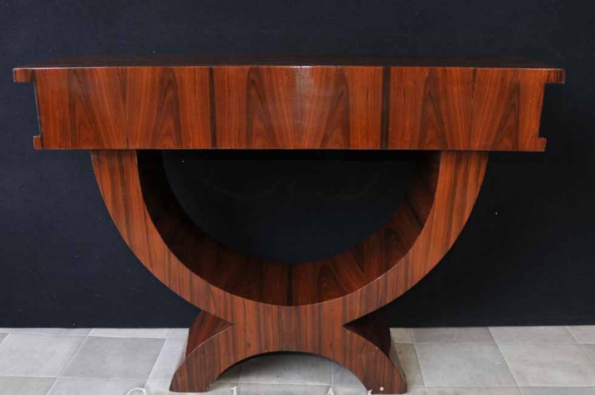 Marvellous art deco style console table in rosewood
Clean and minimal design captures the very essence of the 1920s
Single drawer to the front for storage
We have a large range of other art deco furniture available so please let us know if you