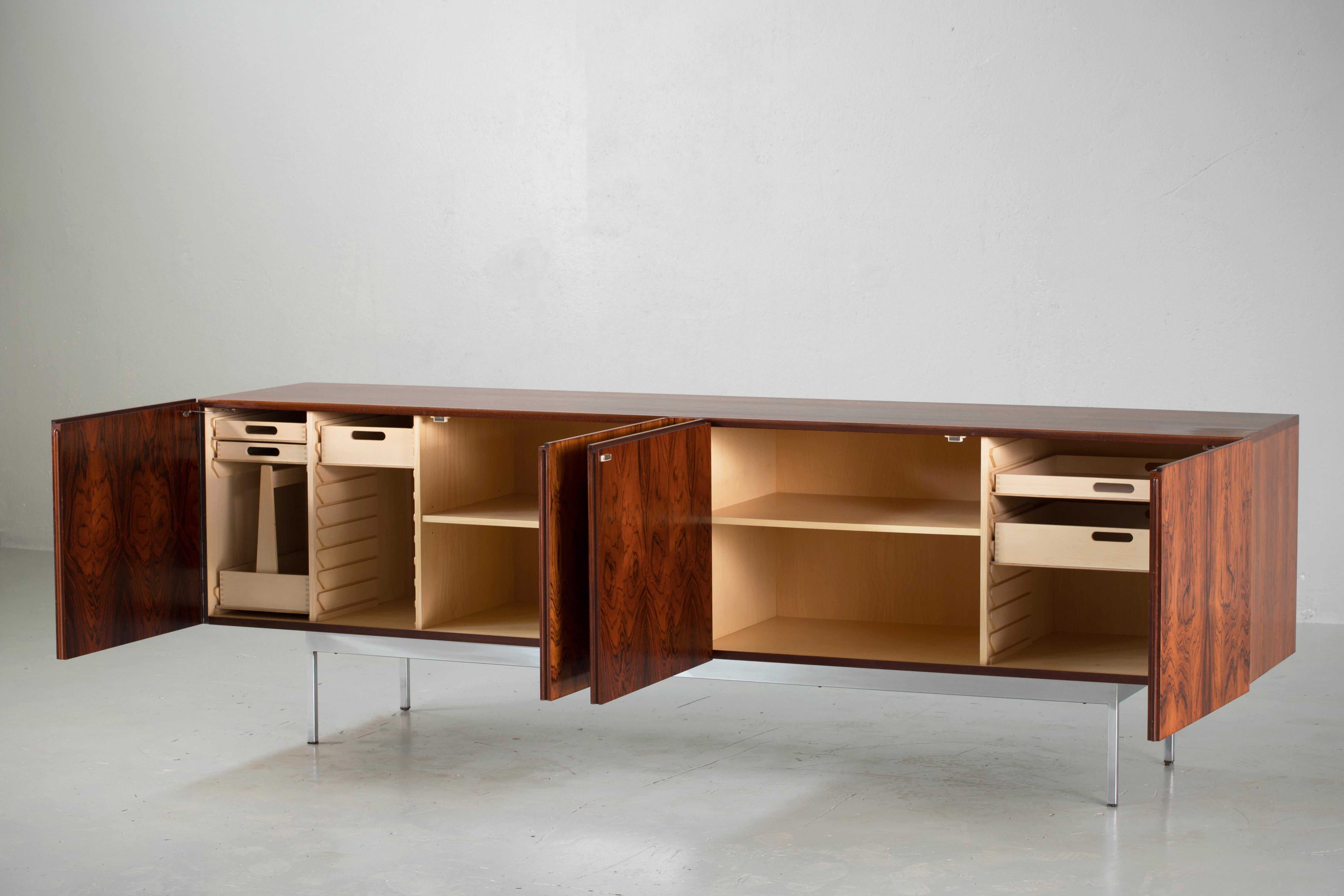 A superlative work of minimalist modern design by the Swiss-born designer Dieter Waeckerlin for his company Idealheim. This credenza was also licensed for production in Germany by Behr Möbel, which commanded a larger market share; Idealheim