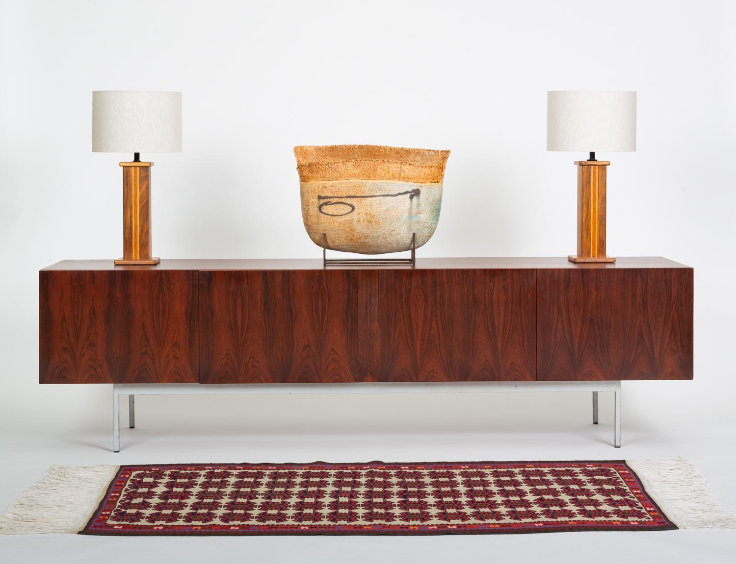 A superlative work of minimalist modern design by the Swiss-born designer Dieter Waeckerlin for his company Idealheim. This credenza was also licensed for production in Germany by Behr Möbel, which commanded a larger market share; Idealheim