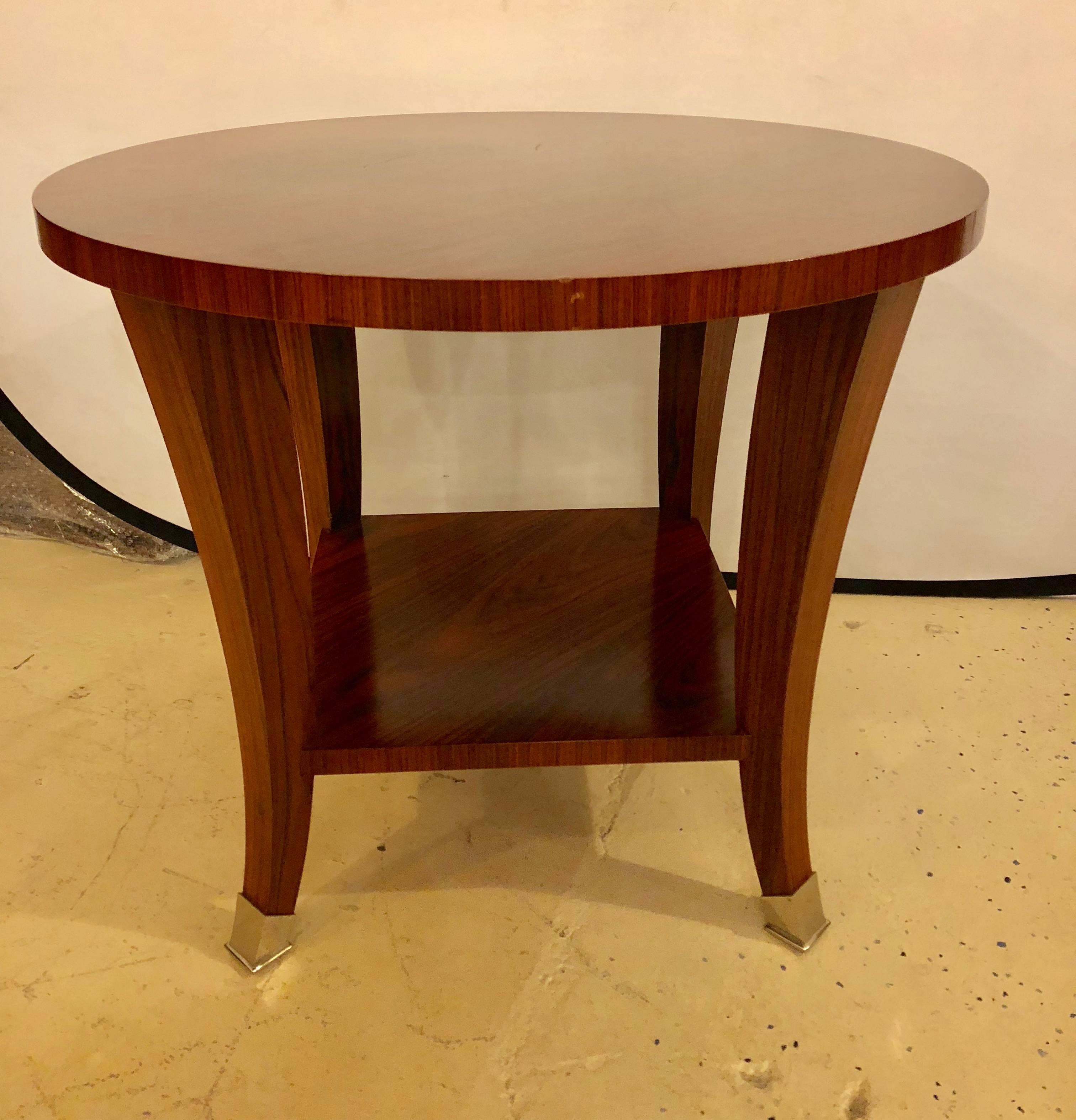 A rosewood baker end or lamp table designed by Barbard Barry. Having chrome feet and a lower shelf this very fashionable end table can be used in most any setting.