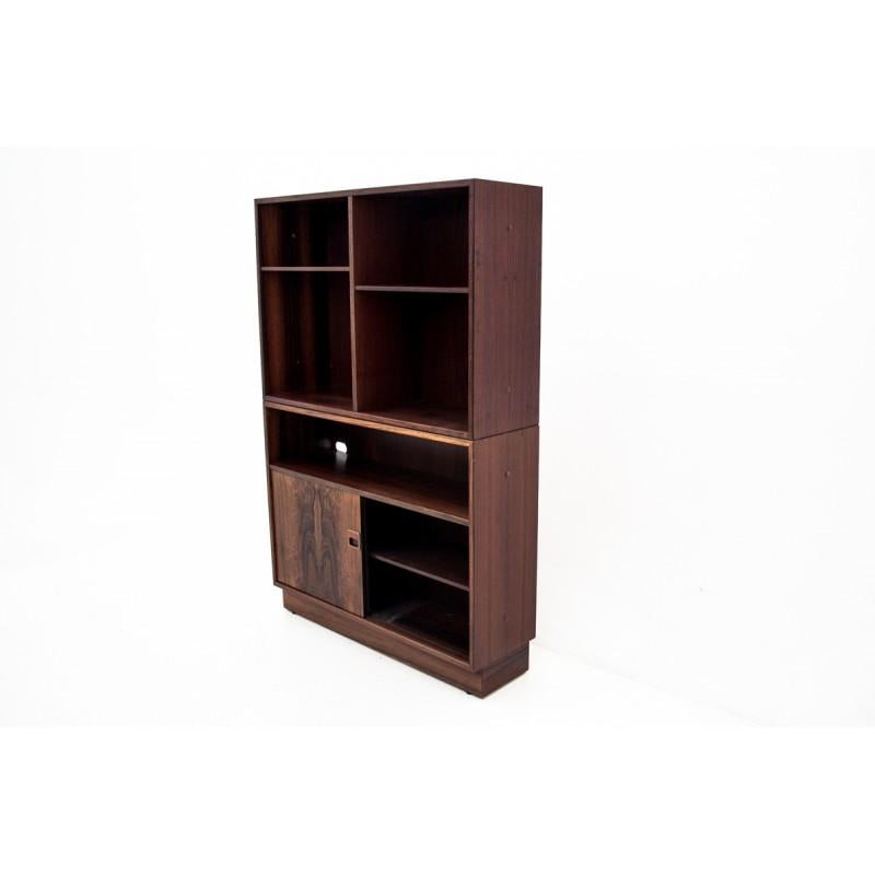 This rosewood bookcase comes from Denmark from 1960s. It has two capacious cabinets at the bottom. Shelves are movable.