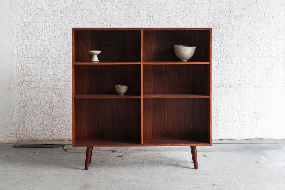 This bookcase cabinet was designed and produced in Denmark in the 1960’s. This cabinet is made of rosewood with a beautiful grain. There are 4 height adjustable bookshelves. In very good condition. 

H: 123 cm
W: 121 cm
D: 30 cm
